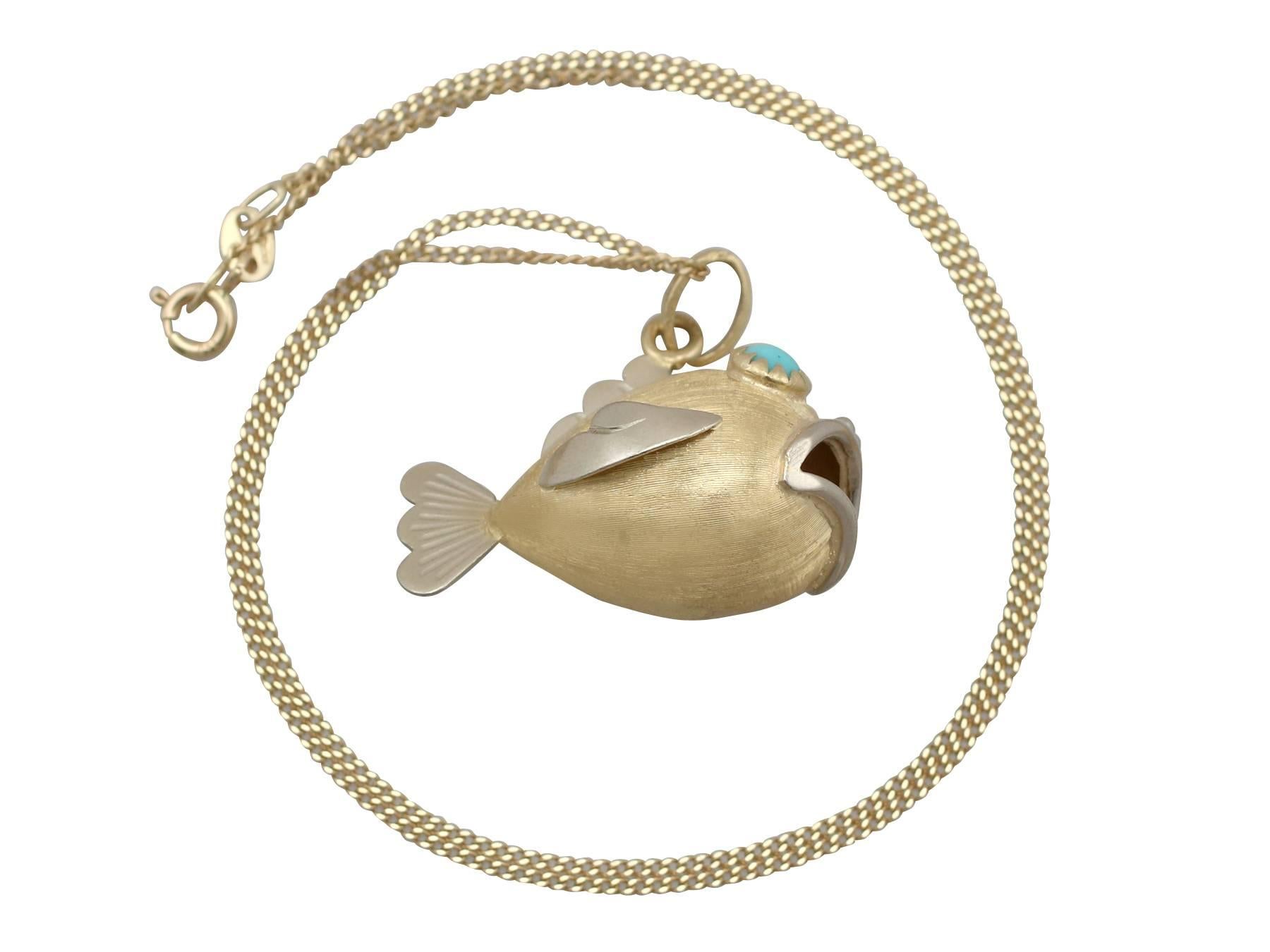 A fine and impressive turquoise, 18 karat yellow gold and 18 karat white gold 'fish' pendant; part of our diverse vintage jewelry and estate jewelry collections

This fine and impressive vintage fish pendant has been crafted in 18k yellow and white