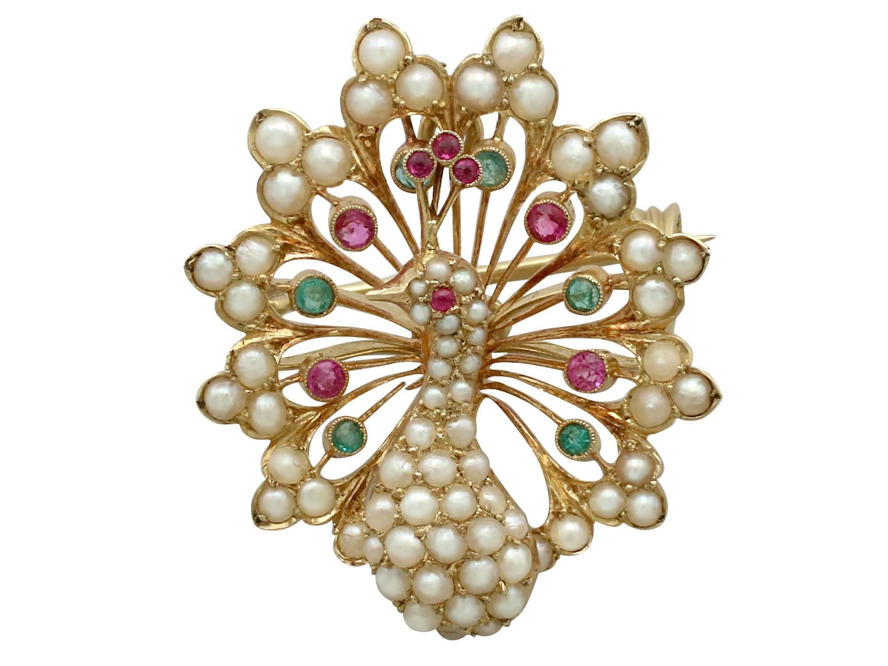 A stunning antique Victorian 0.36 carat ruby and emerald, seed pearl and 18 karat yellow gold 'peacock' brooch; part of our diverse antique jewelry collections

This stunning, fine and impressive peacock pendant has been crafted in 18k yellow