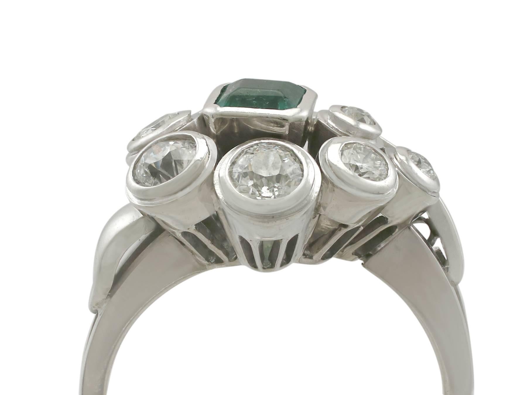 A fine and impressive 0.28 carat emerald and 0.95 carat diamond, 14 karat white gold dress ring; part of our diverse antique jewelry and estate jewelry collections

This fine and impressive emerald dress ring has been crafted in 14 k white