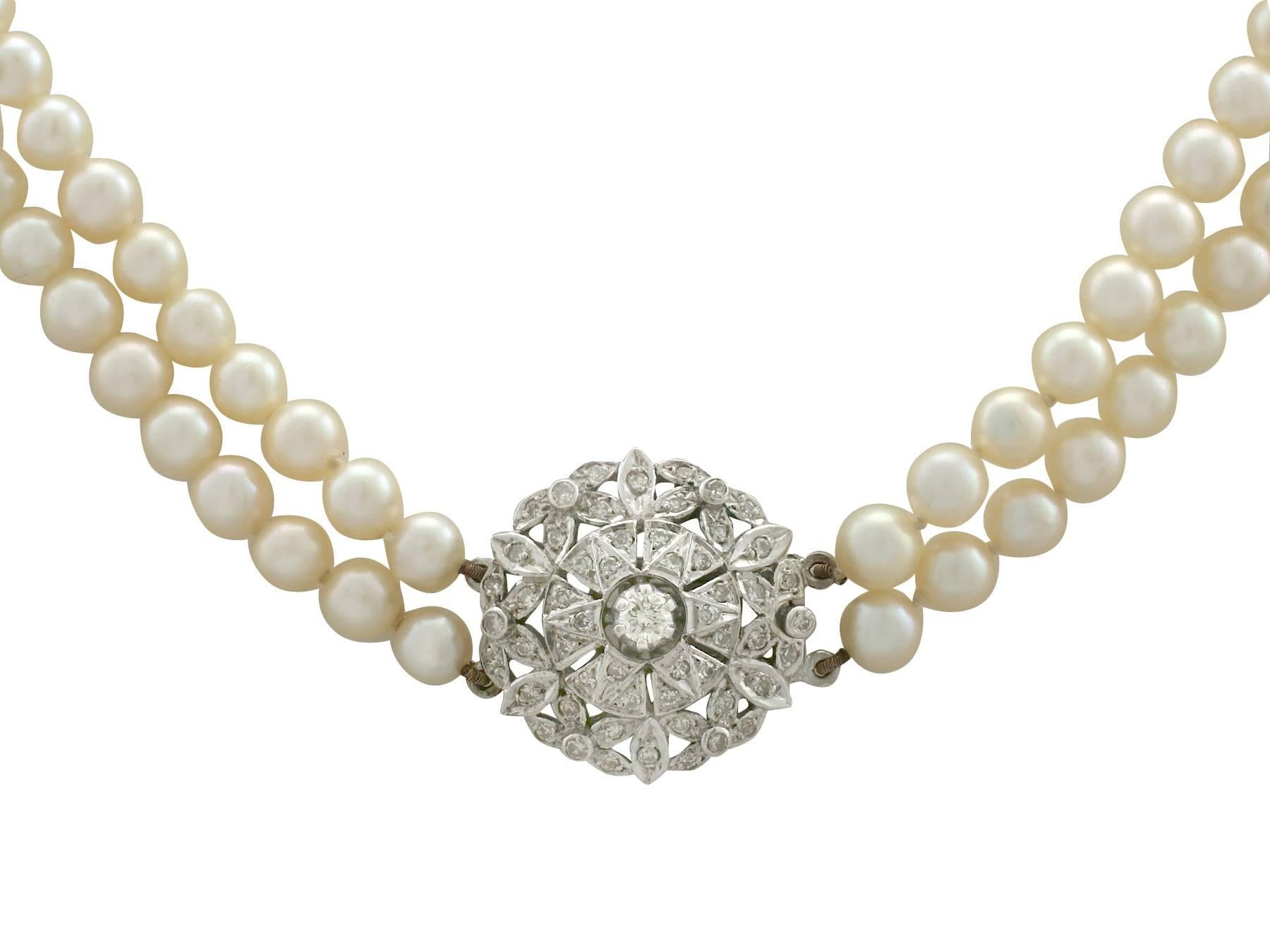 An impressive double strand cultured pearl necklace with 1.05 carat diamond, 9 karat white gold clasp; part of our diverse vintage jewelry and estate jewelry collections

This fine and impressive vintage double strand pearl necklace consists of 140