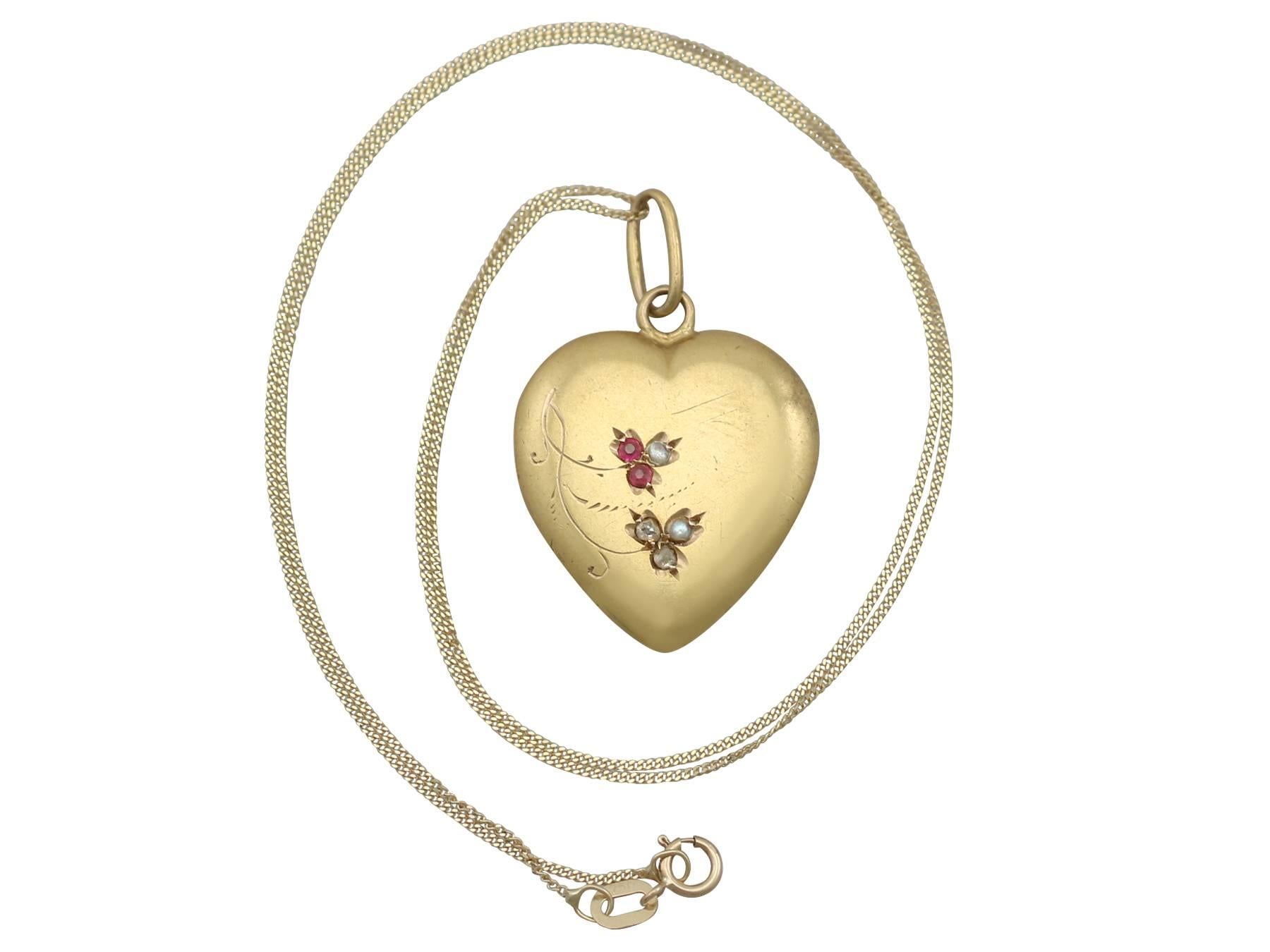 An impressive antique 0.06 carat diamond, 0.05 carat ruby, seed pearl and 18 karat yellow gold heart pendant; part of our diverse antique jewelry collections

This fine and impressive antique heart pendant has been crafted in 18k yellow gold.

The