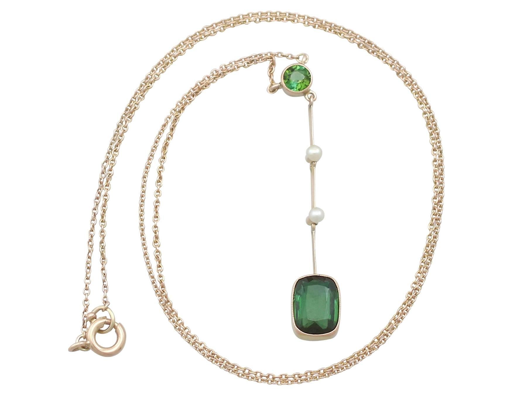 An impressive antique 1.86 carat tourmaline and seed pearl, 9 karat yellow gold necklace; part of our diverse antique jewelry and estate jewelry collections

This fine and impressive tourmaline pendant necklace has been crafted in 9k yellow