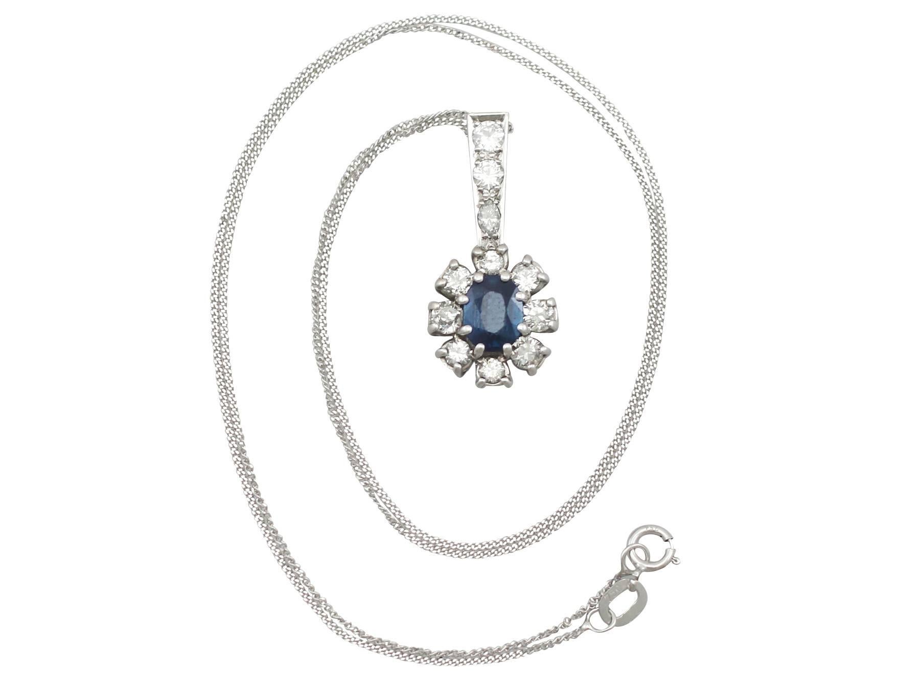 An impressive vintage 1.02 carat blue sapphire and 0.86 carat diamond, 18 karat white gold cluster pendant; part of our diverse vintage jewelry and estate jewelry collections

This fine and impressive sapphire cluster pendant has been crafted in 18k