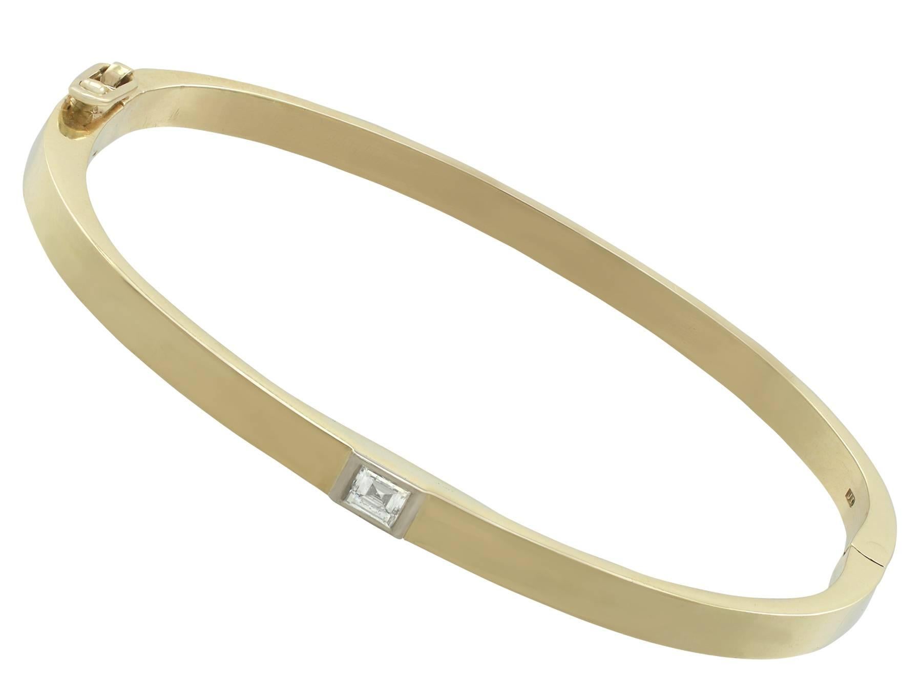 An impressive contemporary English 0.30 carat diamond and 18 karat yellow gold, 18 karat white gold set bangle; part of our diverse diamond jewelry collections.

This fine and impressive single single bangle has been crafted in 18kt yellow gold with