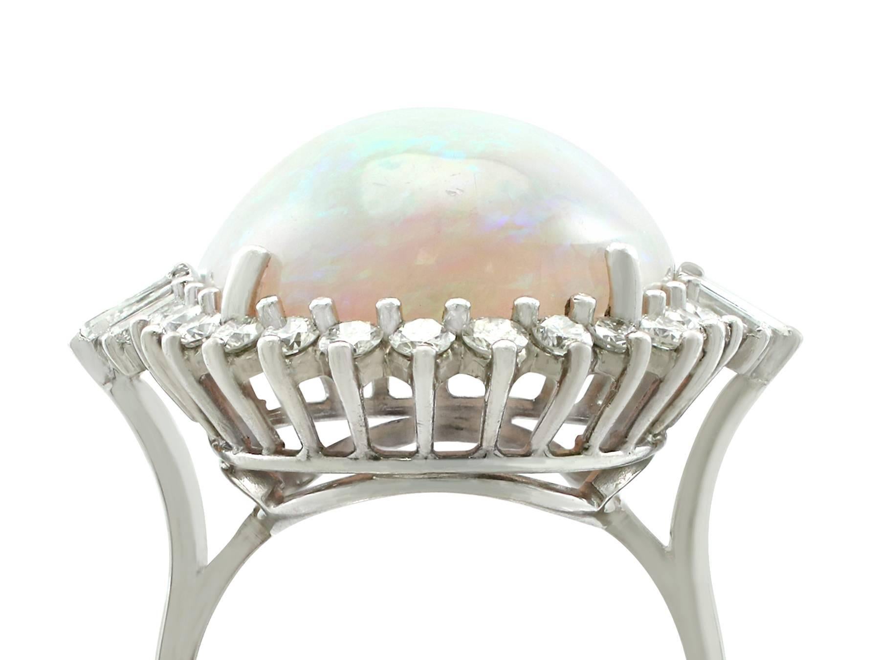 A stunning vintage 1960's 14.65 carat opal and 1.10 carat diamond, 18k white gold cluster style cocktail ring; part of 's diverse gemstone jewelry collections.

This stunning, fine and impressive large opal ring with diamonds has been crafted in 18k