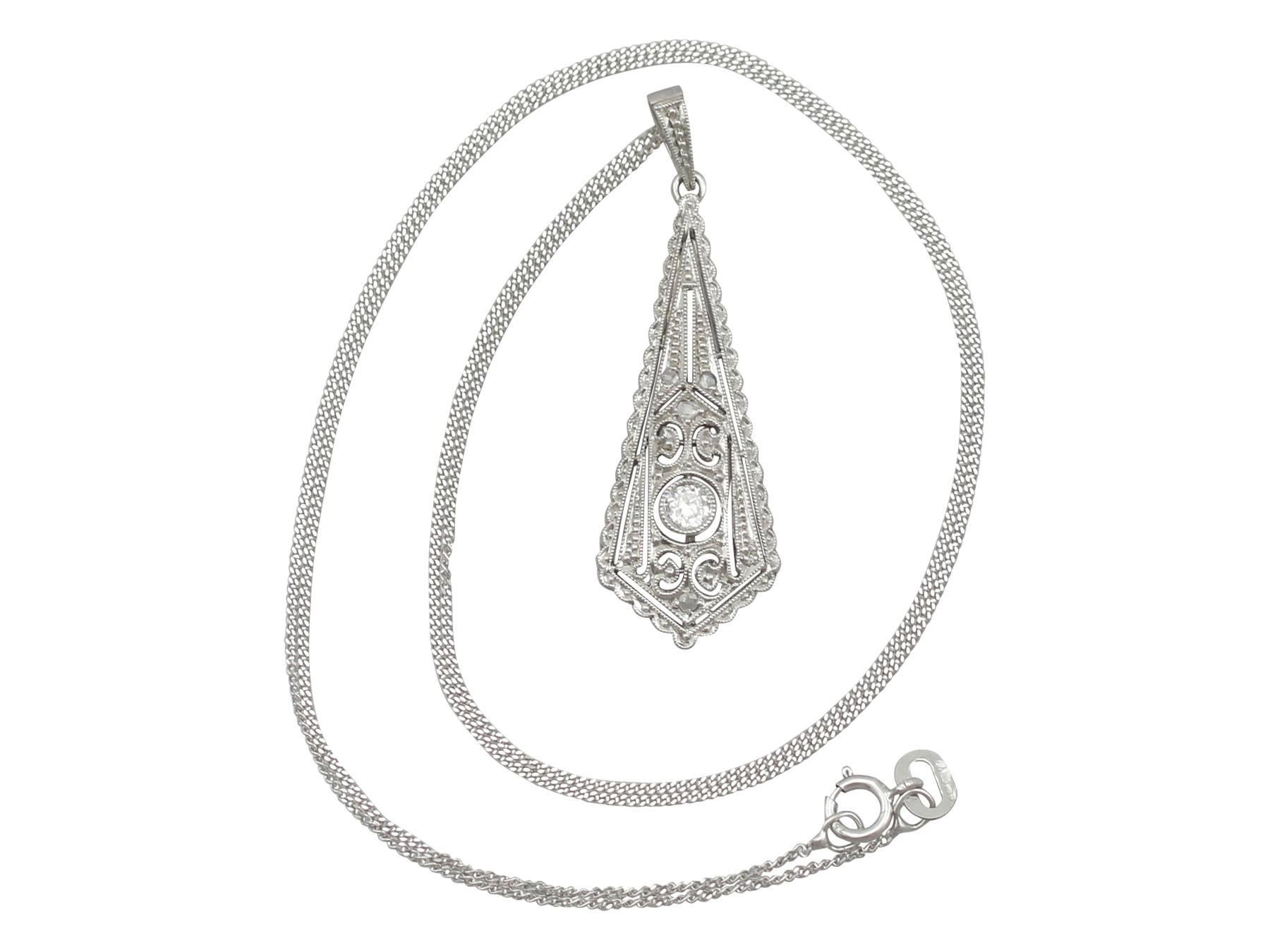 A fine and impressive antique 0.13 carat diamond and 14 karat white gold Art Deco pendant; part of our diverse antique diamond jewelry collections

This fine and impressive antique diamond drop pendant has been crafted in 14k white gold.

The