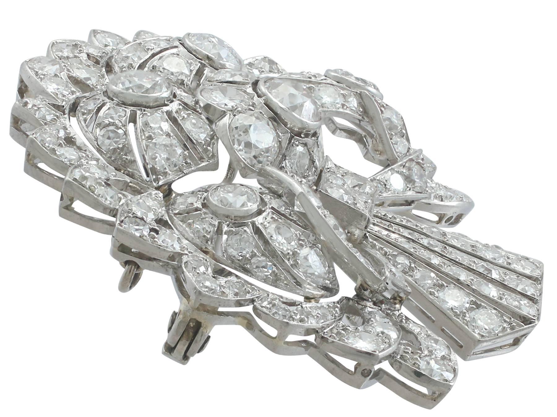 A magnificent and stunning antique Art Deco 4.57 carat diamond and platinum spray brooch by S.J. Rood; part of our diverse antique jewelry and estate jewelry collections.

This magnificent, stunning and impressive, large diamond brooch has been