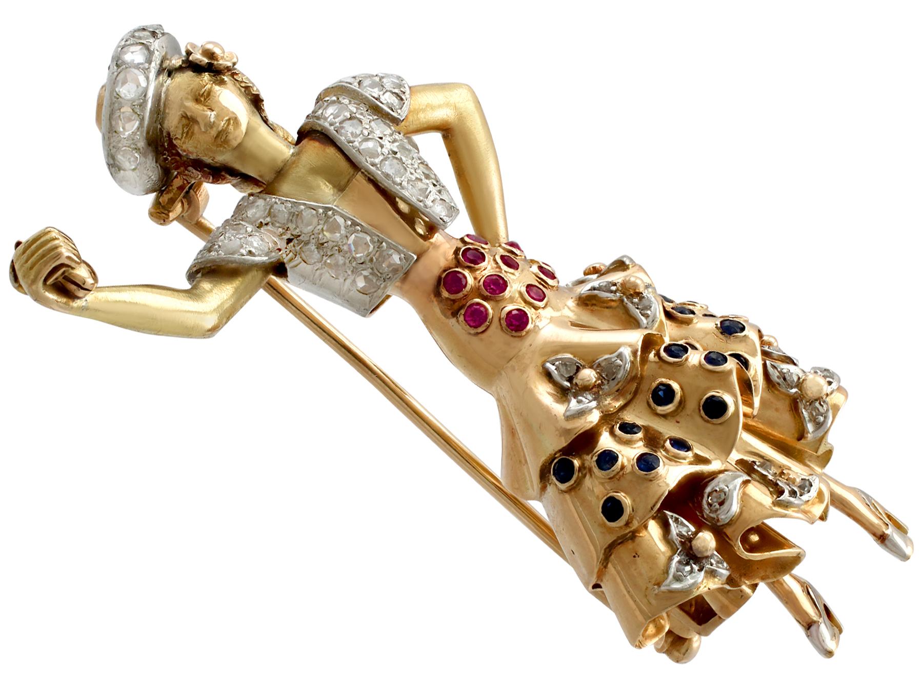 A stunning vintage 1.04 carat diamond, 0.40 carat sapphire, 0.31 carat ruby, 18 carat yellow and rose gold and platinum set 'flamenco dancer' brooch; part of our diverse vintage jewellery collections.

This stunning multi-gem brooch has been crafted
