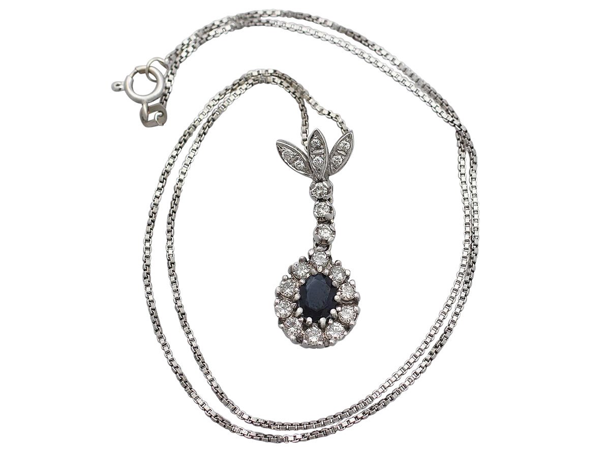 A fine and impressive 0.95 carat natural blue sapphire and 0.72 carat diamond vintage pendant in 14 karat white gold; part of our diverse vintage necklace and estate jewelry collections

This fine vintage sapphire pendant has been crafted in 14k