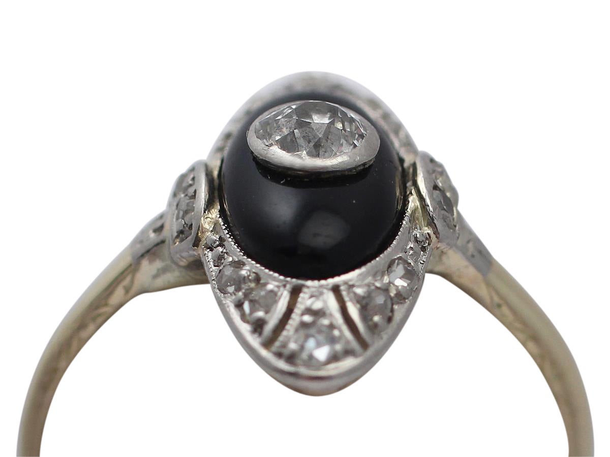 A fine and impressive antique 0.35 carat diamond and black onyx, 14 karat yellow gold, 14 karat white gold set dress ring in the Art Deco style; part of our antique jewelry/estate jewelry collections

This fine and impressive antique black onyx ring