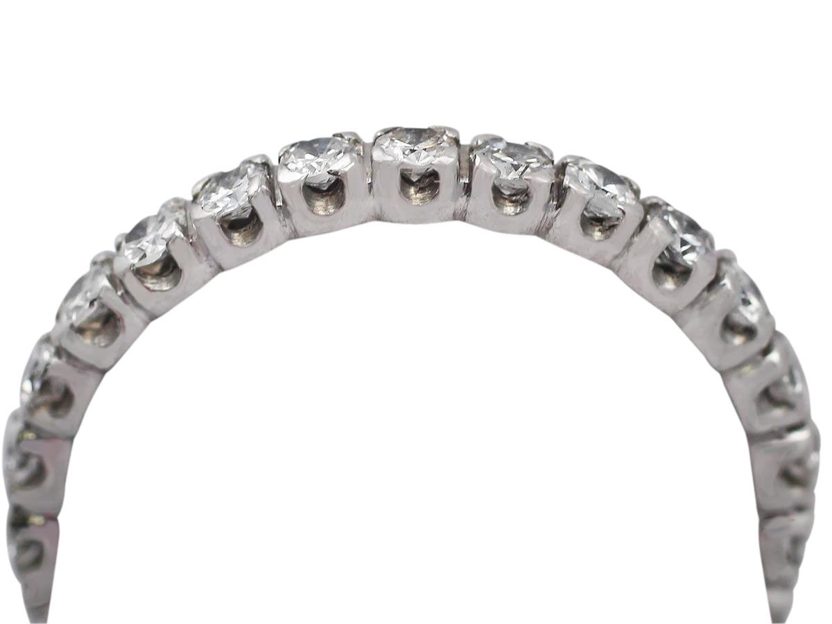 A fine and impressive vintage 1.32 carat diamond and platinum full eternity ring; part of our vintage jewelry/estate jewelry collections

This impressive vintage diamond full eternity ring has been crafted in platinum.

This vintage ring is set