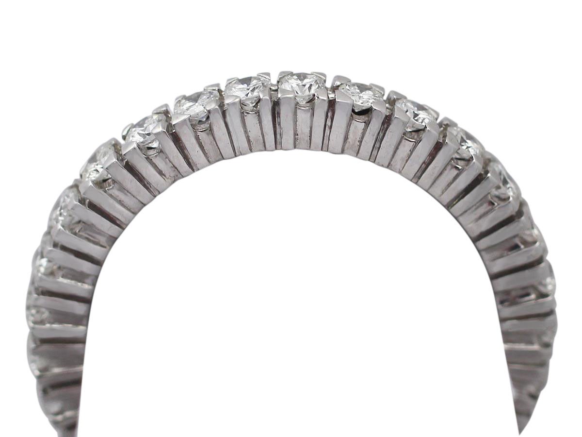 A fine and impressive 0.80 carat diamond, 18 karat white gold full eternity ring; part of our jewelry/estate jewelry collections.

This impressive eternity band ring has been crafted in 18k white gold.

This ring is set with individually displayed,