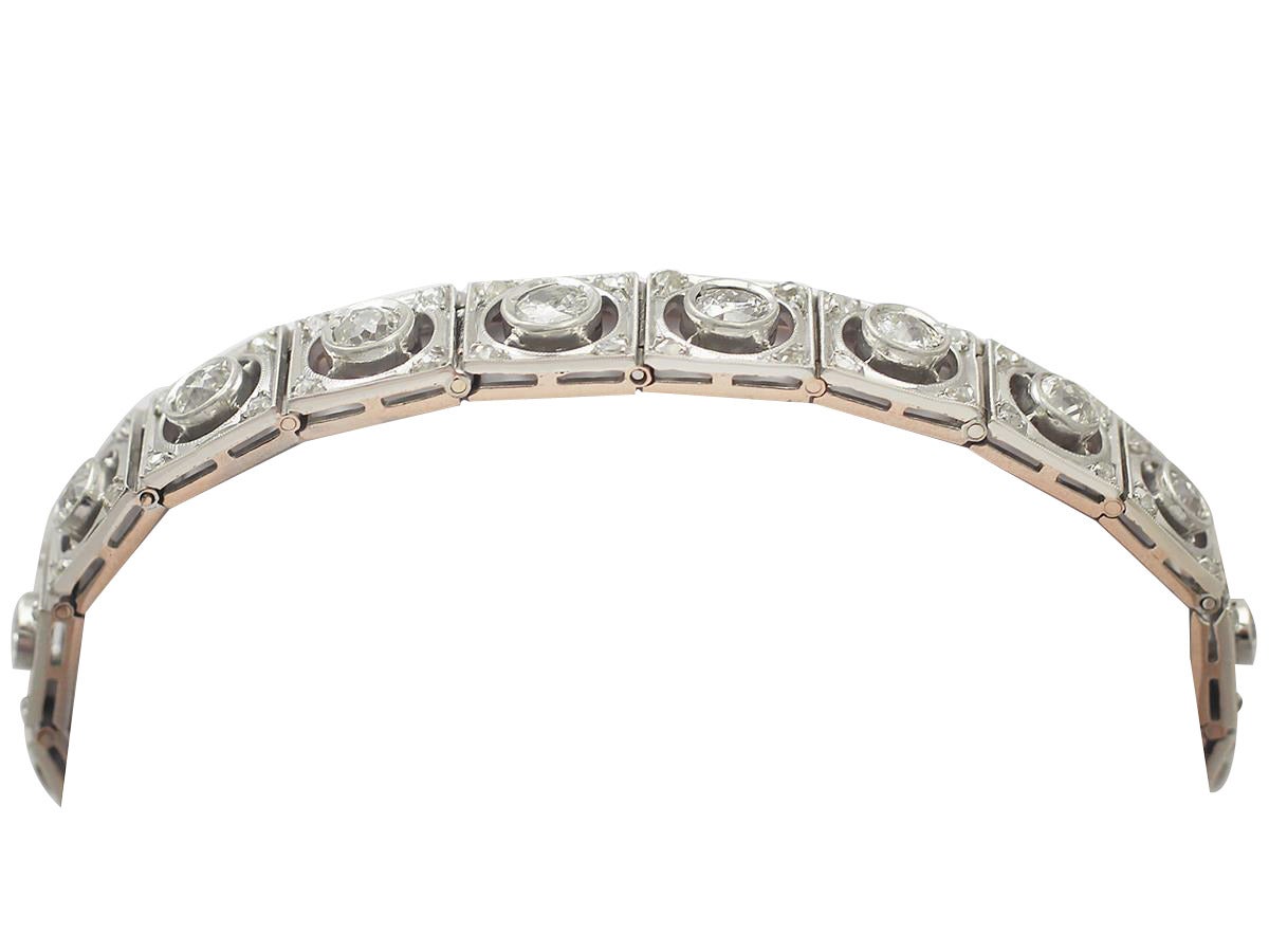 A fine and impressive 4.38 carat diamond, 18 karat yellow gold, platinum set line bracelet; part of our diverse antique jewelry and estate jewelry collections

This fine antique diamond bracelet has been crafted in 18k yellow gold with a platinum