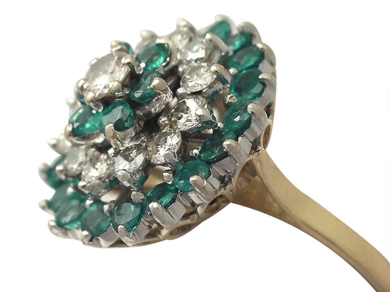 A fine and impressive vintage cocktail ring embellished with 1.86 carats diamonds and 1.70 carats natural emeralds set in 18 karat white and yellow gold; part of our vintage jewelry and estate jewelry collections

This fine vintage cocktail ring