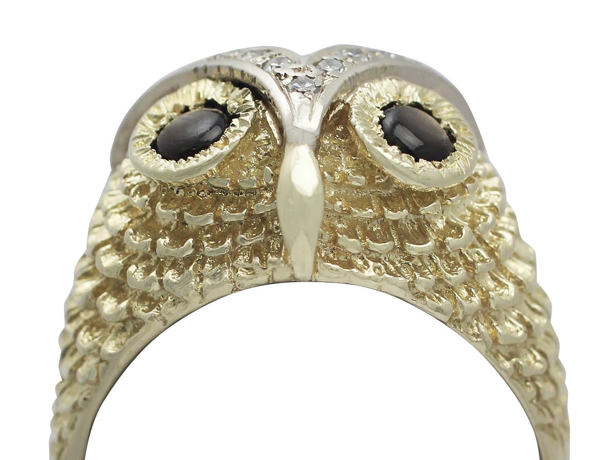 A fine and impressive contemporary 0.42 carat natural black star sapphire and 0.30 carat diamond, 18 carat yellow gold, 15 karat yellow gold and 15 karat white gold set 'owl' cocktail ring; part of our diverse contemporary jewelry collection

This