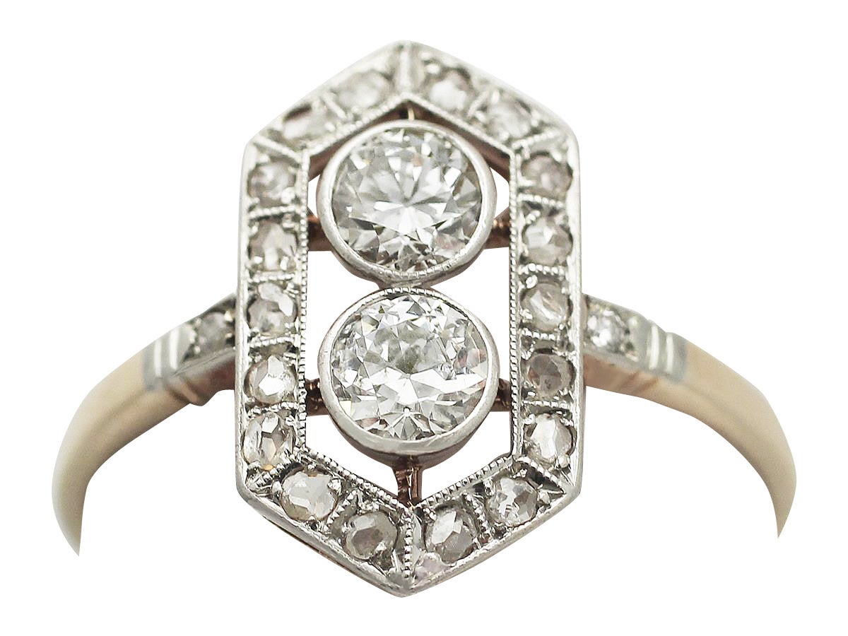 A stunning, fine and impressive antique 0.78 carat diamond, 14 karat yellow gold, 14 karat white gold set dress ring in the Art Deco style; part of our antique jewelry and estate jewelry collections

This stunning antique diamond cocktail ring has