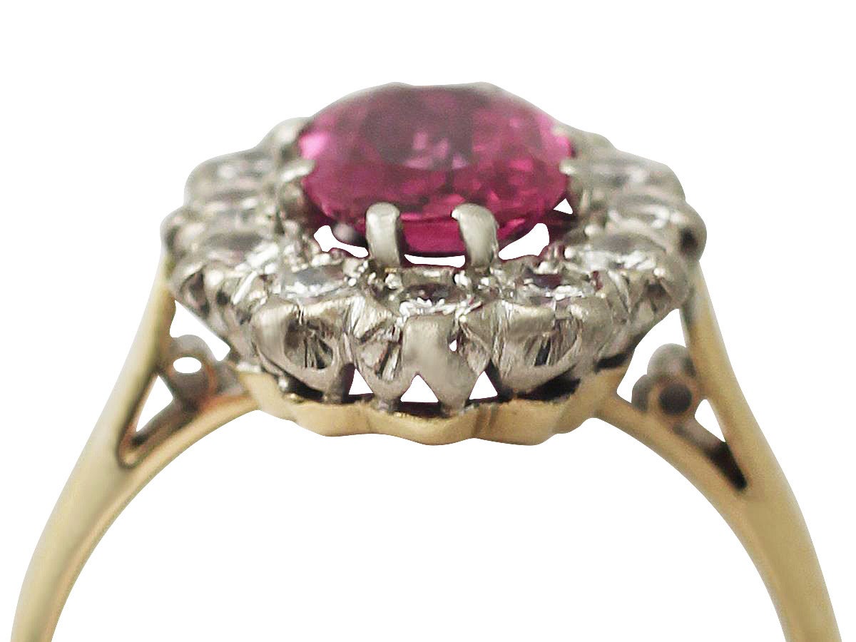 A stunning, fine and impressive vintage 1.26 carat natural ruby and 0.60 carat diamond, 18 karat yellow gold, platinum set dress ring; part of our vintage jewelry and estate jewelry collections

This stunning vintage ruby ring has been crafted in