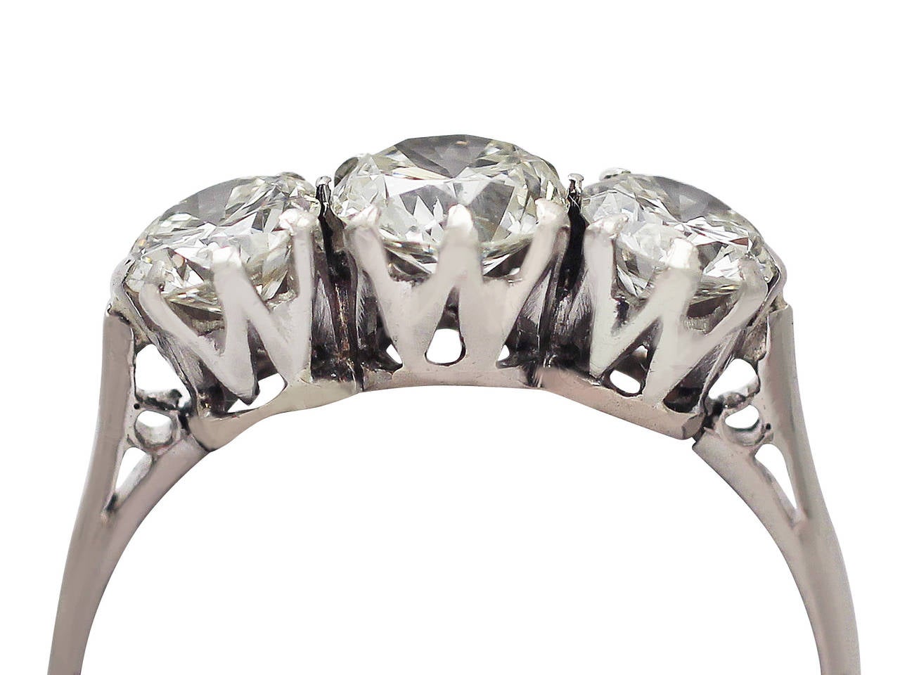 A stunning, fine and impressive antique 1.50 carat diamond and platinum three stone/trilogy ring; part of our antique jewellery and estate jewelry collections.

This stunning diamond trilogy ring has been crafted in platinum.

The pierced decorated