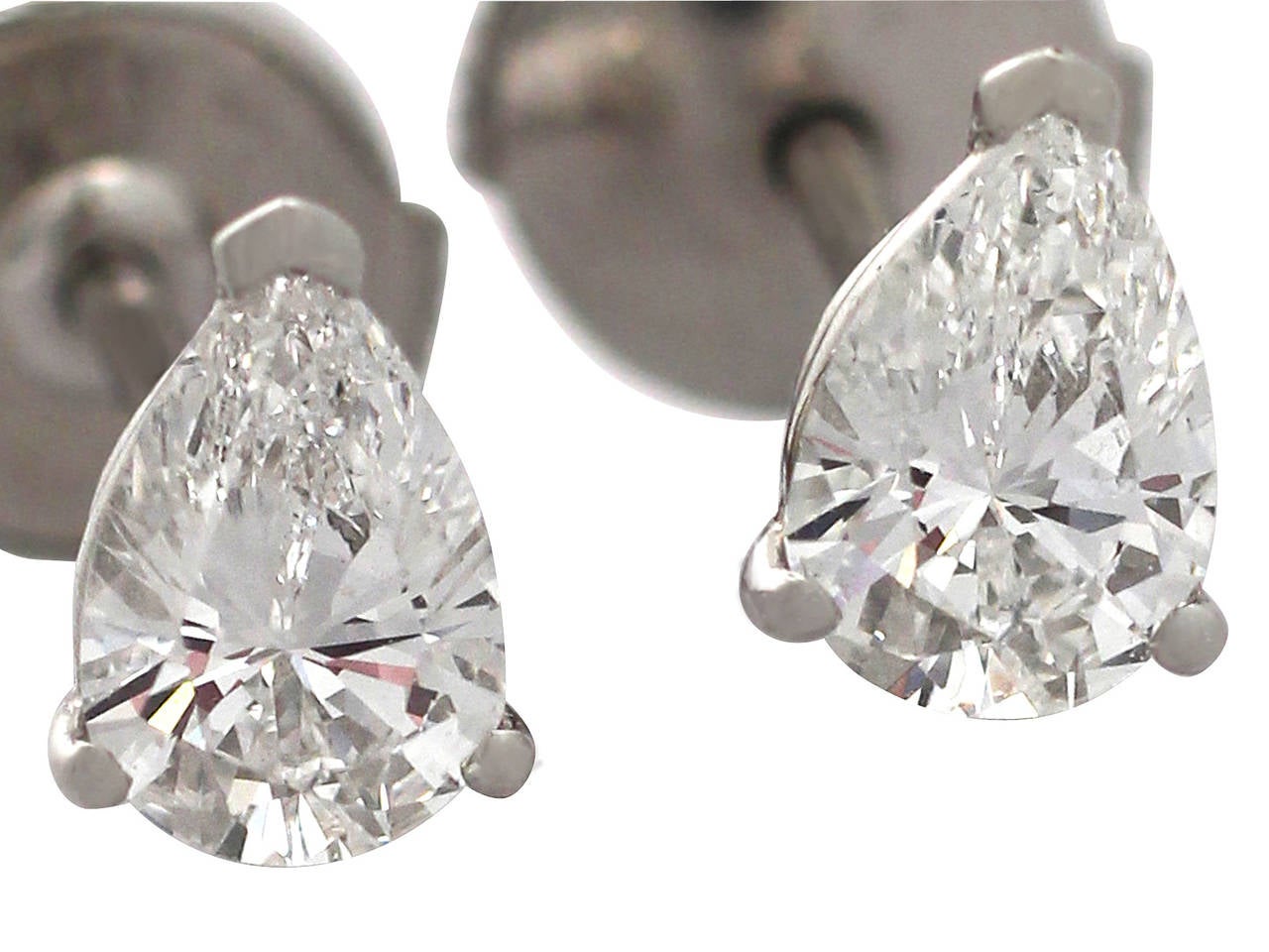 A fine and impressive pair of contemporary 1.15 carat pear cut diamond, platinum stud earrings; part of our diverse jewelry/jewelry collections

These impressive 1.15 carats diamond earrings are crafted in platinum.

Each pierced decorated pear