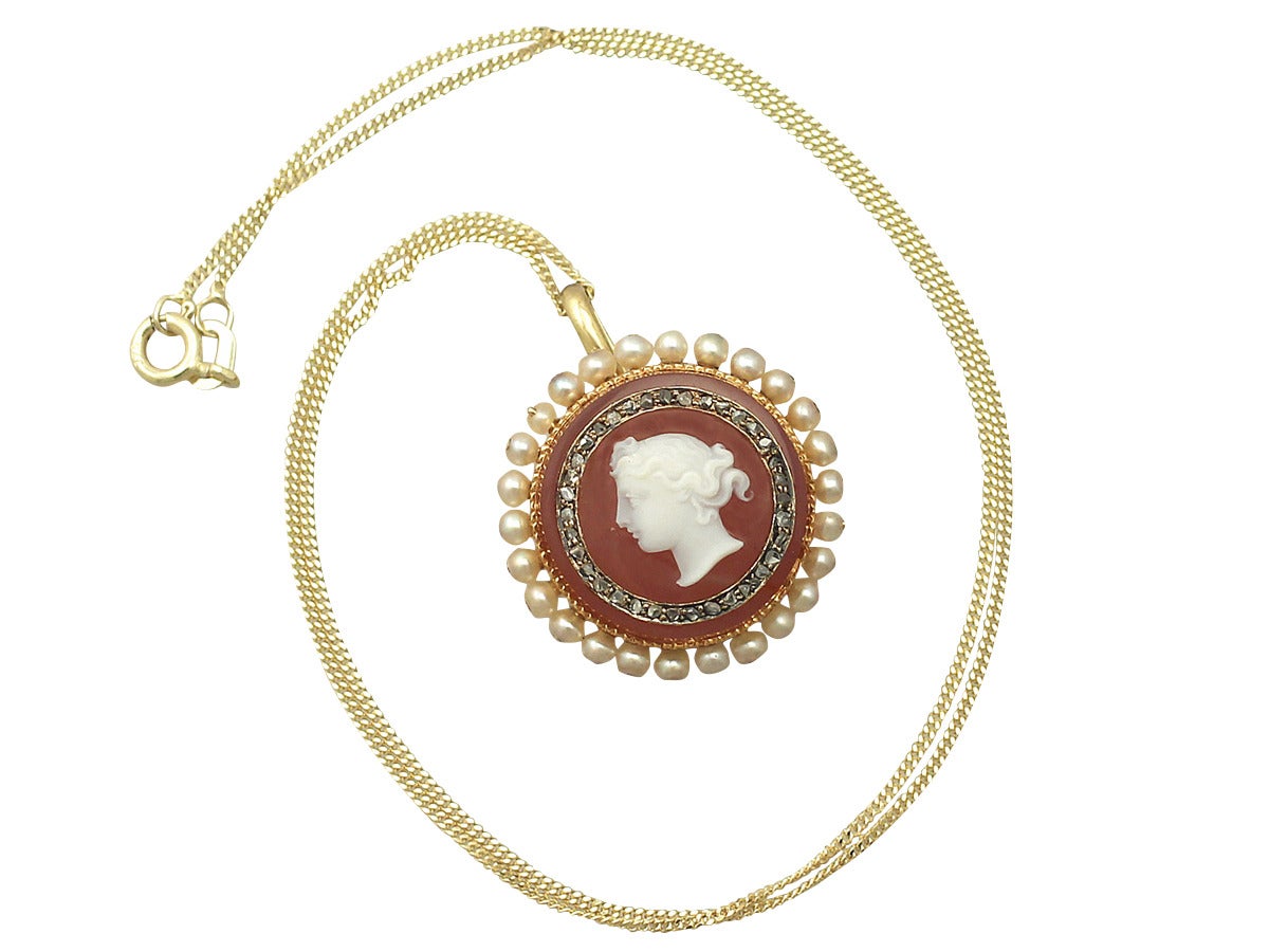 A fine and impressive antique Victorian cameo pendant with pearls, in 18 karat yellow gold; part of our antique jewelry and estate jewelry collections

This fine antique Victorian cameo has been crafted in 18 karat yellow gold and