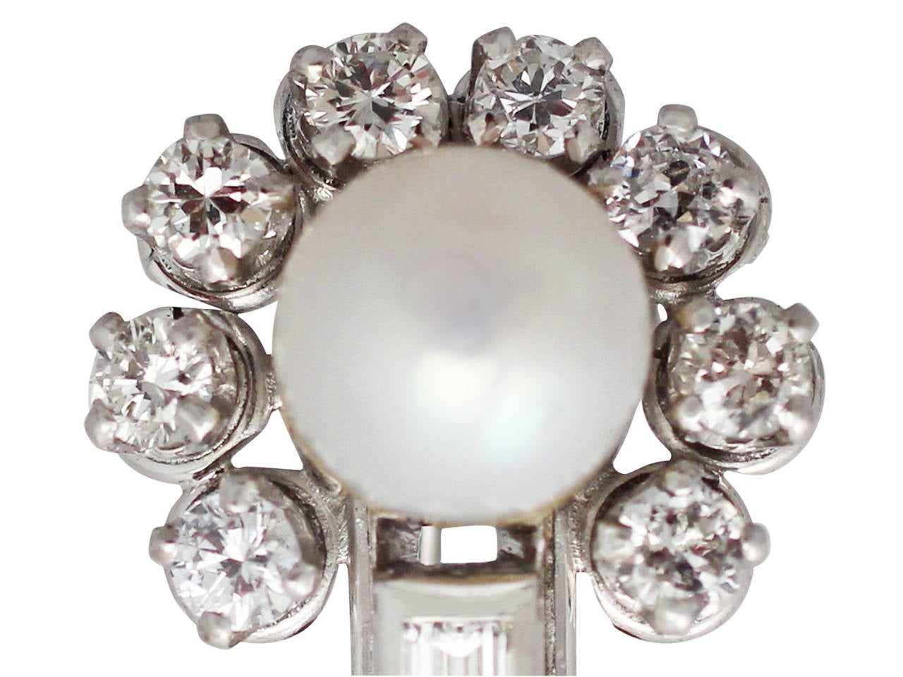 A fine and impressive pair of vintage 1.04 carat diamond and pearl, 18 carat white gold earrings; an addition to our vintage jewelry collections.

These impressive vintage pearl earrings have been crafted in 18k white gold.

Each earring displays a