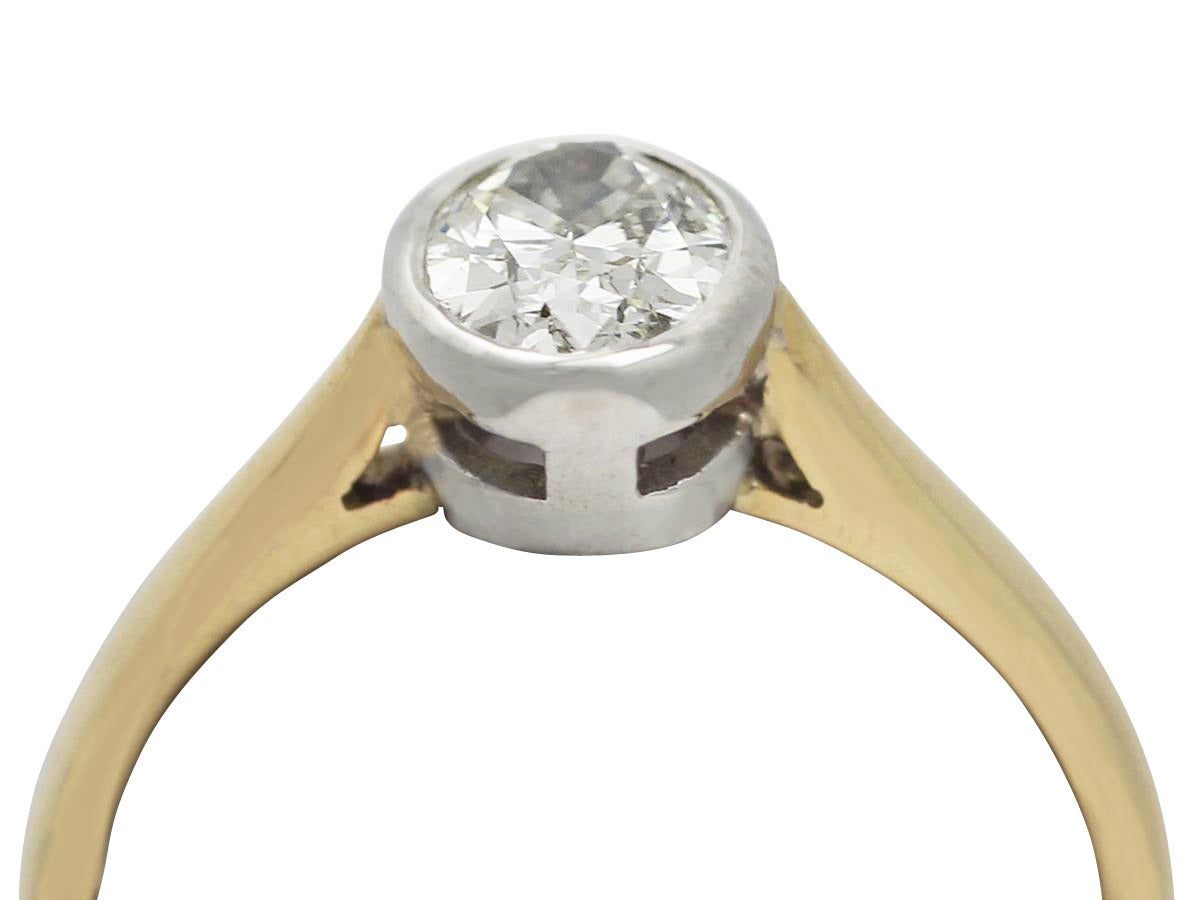 A fine contemporary 1.00 carat oval cut diamond, 18 karat yellow gold, 18 karat white gold set, solitaire ring; an addition to our diverse range of diamond jewellery

This contemporary diamond ring has been crafted in 18 karat yellow gold, with a