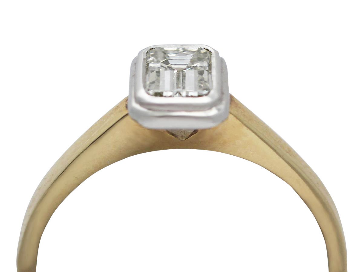 A fine and impressive 0.75 carat emerald cut diamond, 18k white gold set, 18k yellow gold solitaire ring; part of our diverse diamond jewelry collection

This impressive contemporary emerald cut solitaire has been crafted in 18k yellow gold

The
