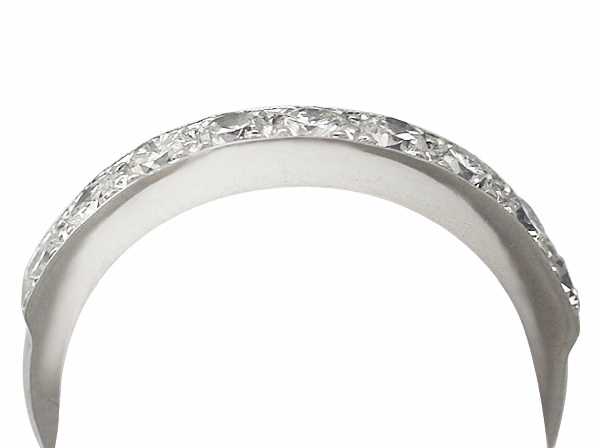 A fine and impressive 0.54 ctarat diamond and platinum half eternity ring; part of our vintage jewelry/estate jewelry collections

This impressive vintage diamond eternity ring has been crafted in platinum.

The ring is multi-claw set with nine