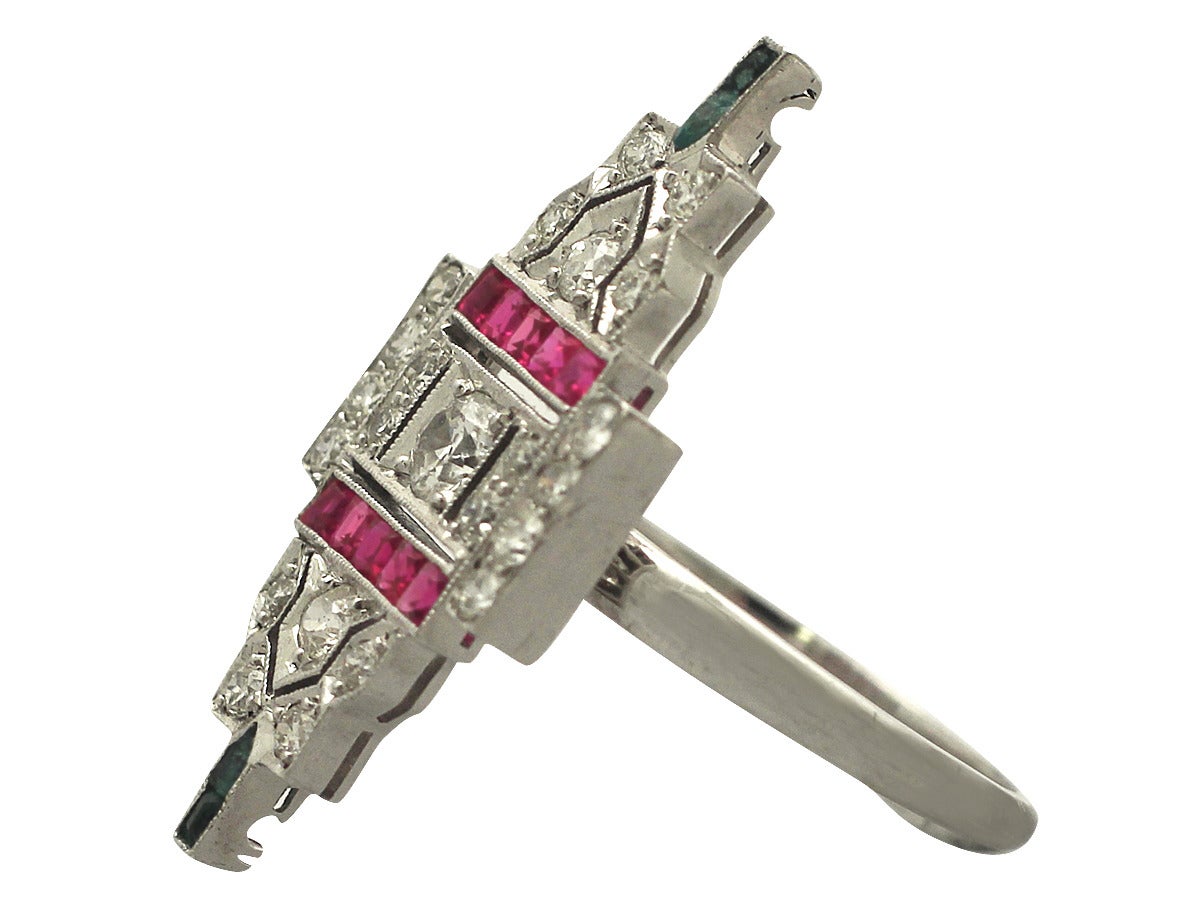 A fine and impressive 1.38 carat diamond, emerald and ruby and 14 karat white gold Art Deco style dress ring; part of our diverse vintage jewelry and estate jewelry collections

This fine and impressive vintage dress ring has been crafted in 14k