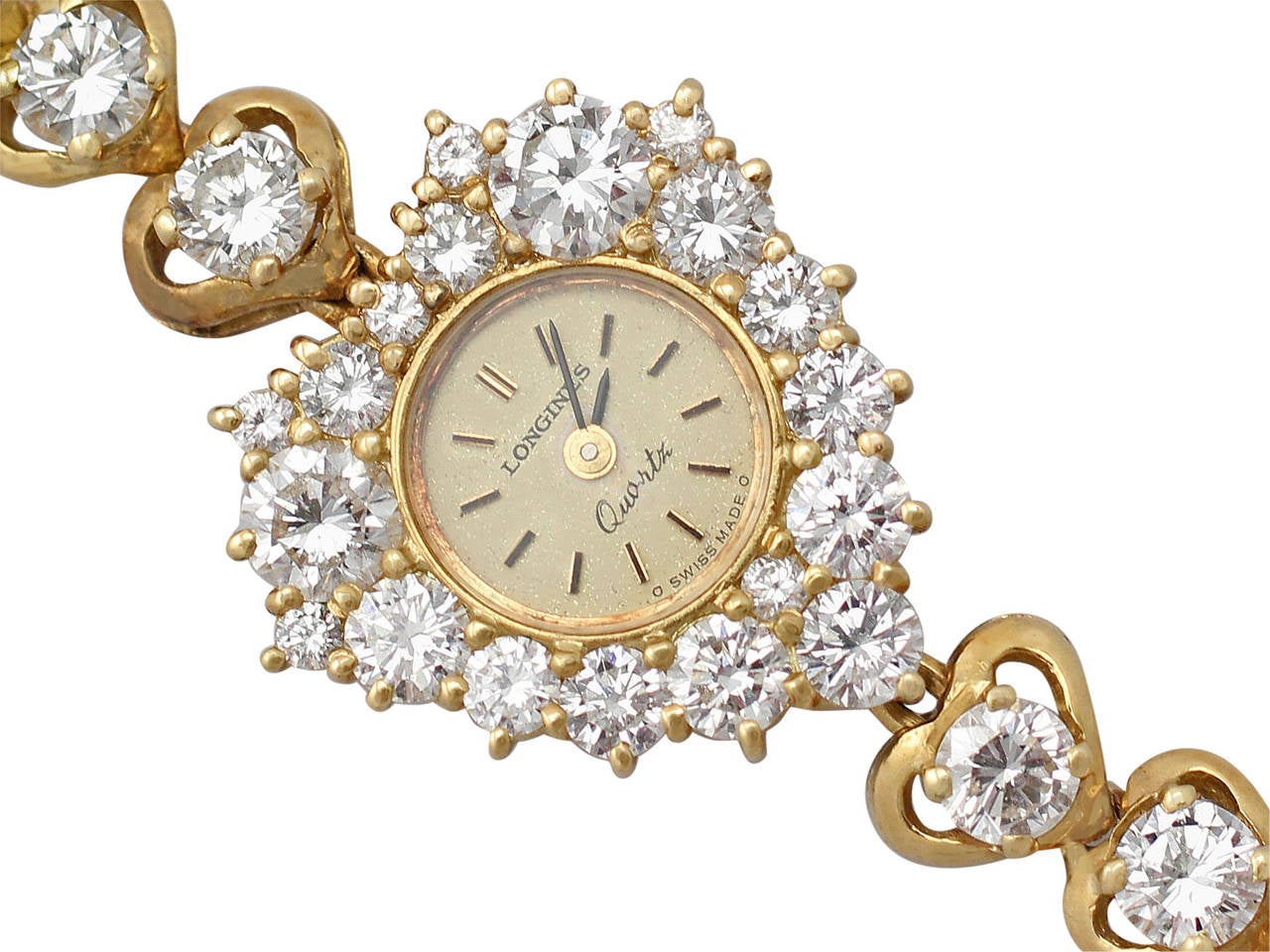 This fine contemporary quartz diamond cocktail watch made by Longines has been crafted in 18k yellow gold.

The eye-catching heart shaped watch bezel is embellished with nineteen modern brilliant round cut diamonds of various sizes, claw set to