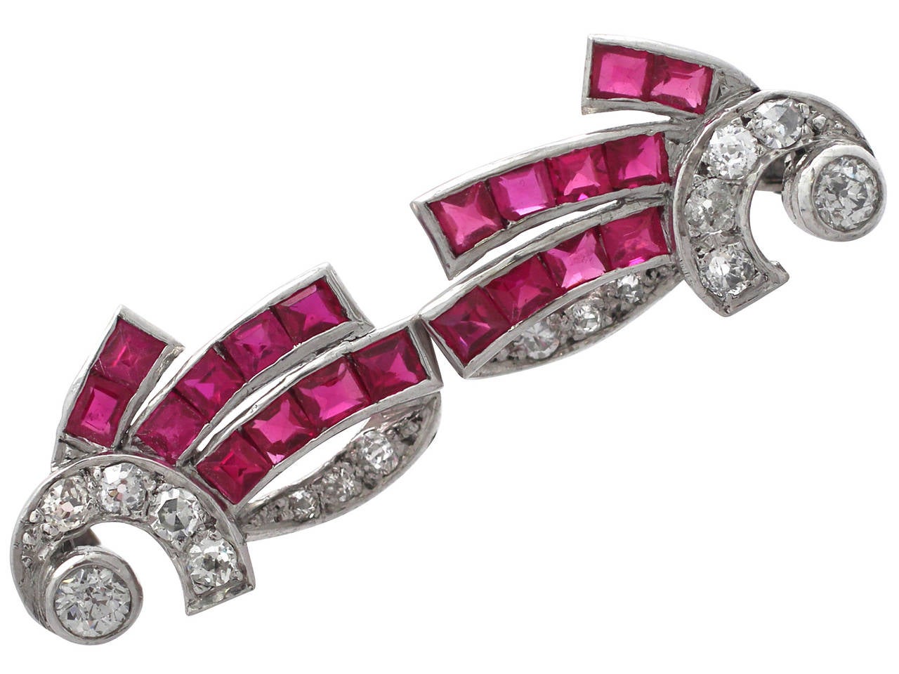 A fine pair of 1.00 carat ruby and 0.48 carat diamond, 14 carat white gold Art Deco style earrings; an addition to our jewelry collections.

These fine Art Deco style ruby earrings have been crafted in 14k white gold.

Each earring has a feature