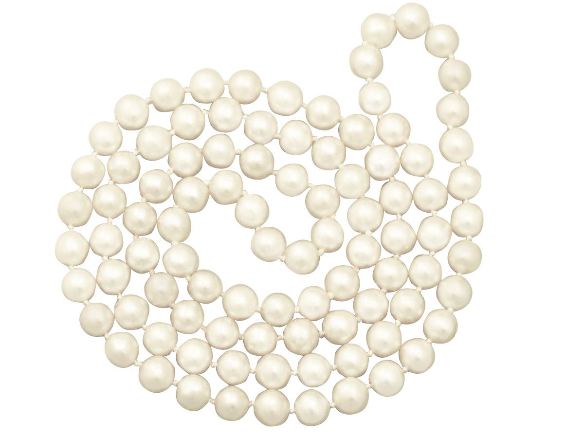 A fine and impressive vintage single strand, opera length cultured pearl necklace; part of our diverse vintage jewelry and estate jewelry collections

This impressive vintage pearl necklace displays a total of ninety-four 7mm cultured
