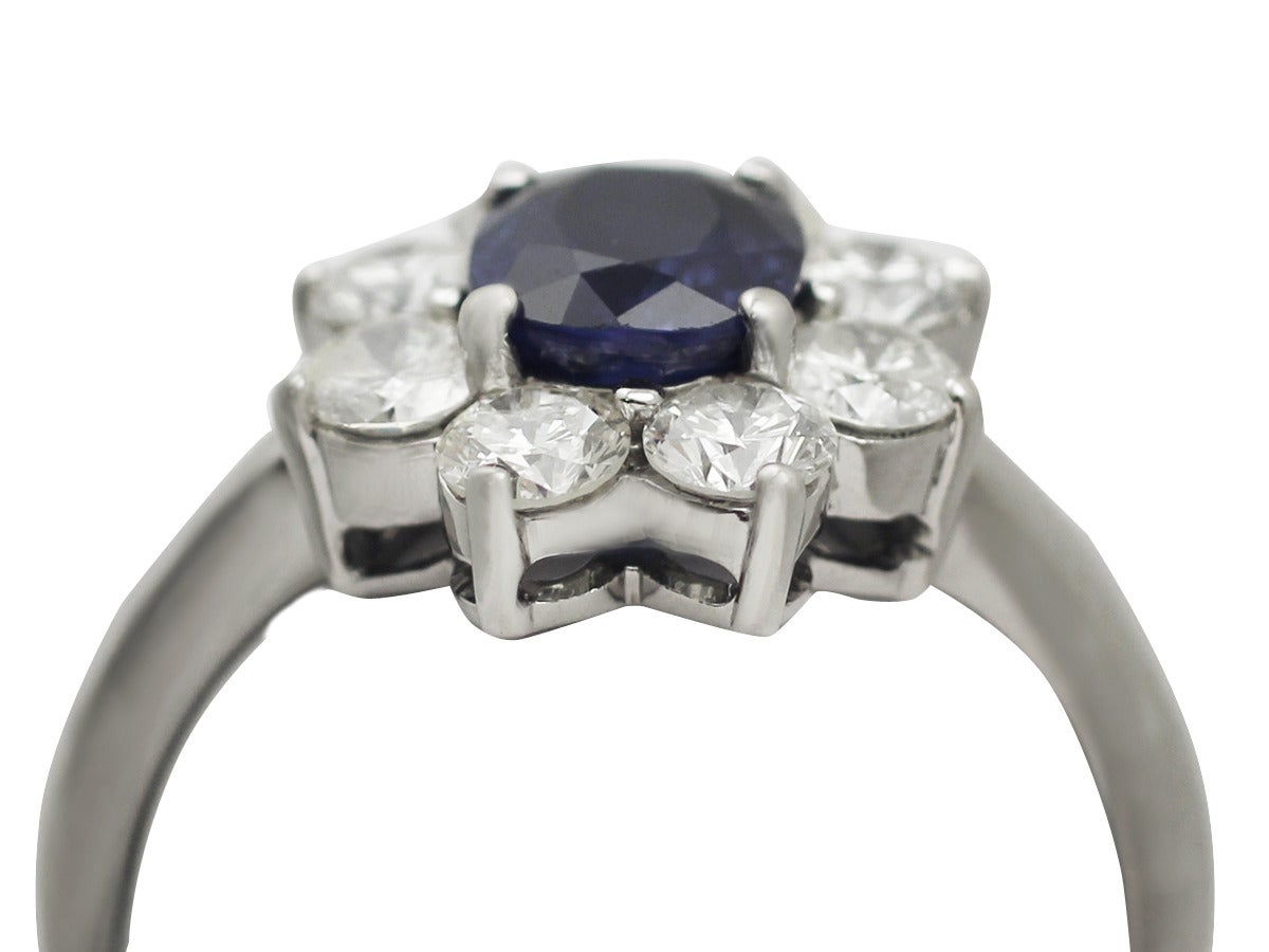 A fine and impressive vintage 1.48 carat natural sapphire and 1.45 carat diamond, 18 karat white gold dress ring; part of our jewelry and estate jewelry collections

This impressive vintage sapphire and diamond cluster ring has been crafted in 18k