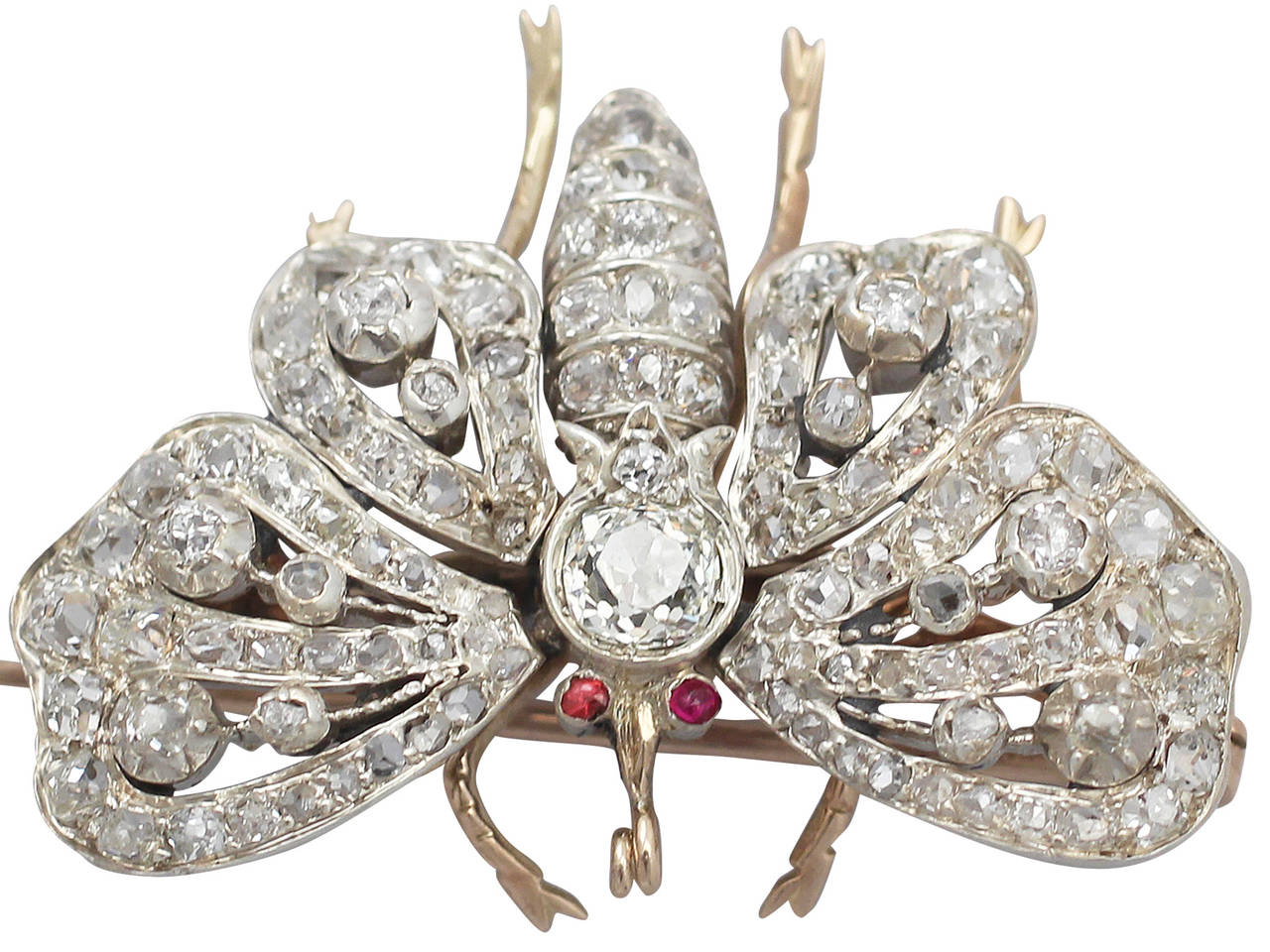 A stunning, fine and impressive 15 karat yellow gold, silver set antique butterfly brooch with old cut diamonds; part of our diverse antique jewelry and estate jewelry collections

This stunning antique Victorian brooch has been crafted in 15k