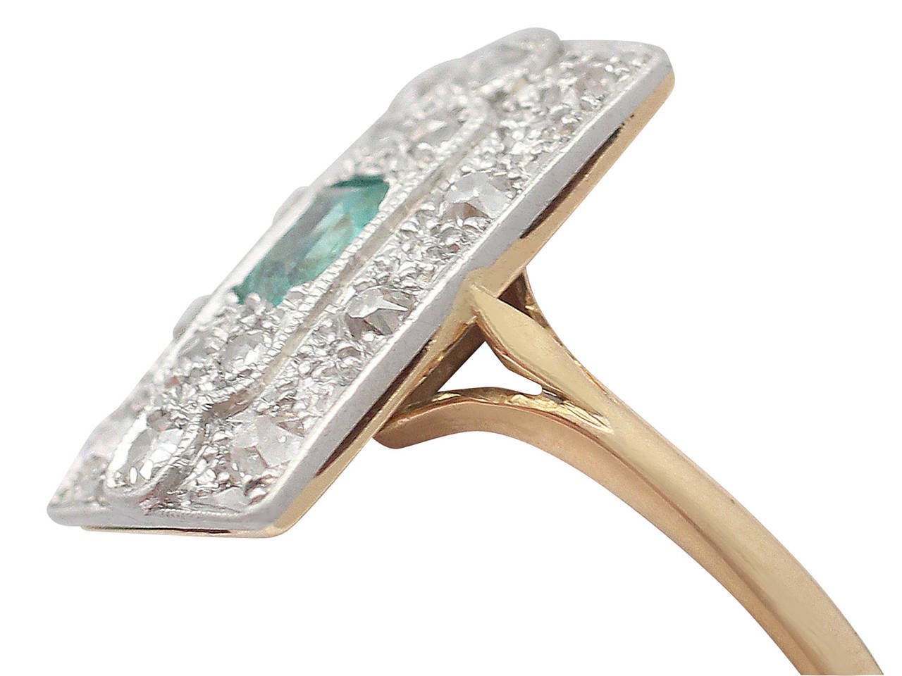 A very fine 0.32 carat emerald and 0.56 carat diamond, 18 karat yellow gold, platinum set dress ring; part of our antique jewelry / estate jewelry collections

This fine antique emerald dress ring has been crafted in 18k yellow gold and
