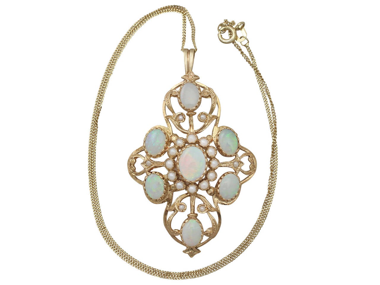 A fine and impressive vintage opal and pearl, 9 karat yellow gold pendant in the Victorian style; part of our diverse vintage jewelry and estate jewelry collections

This fine and impressive vintage pendant has been crafted in 9k yellow gold.

The