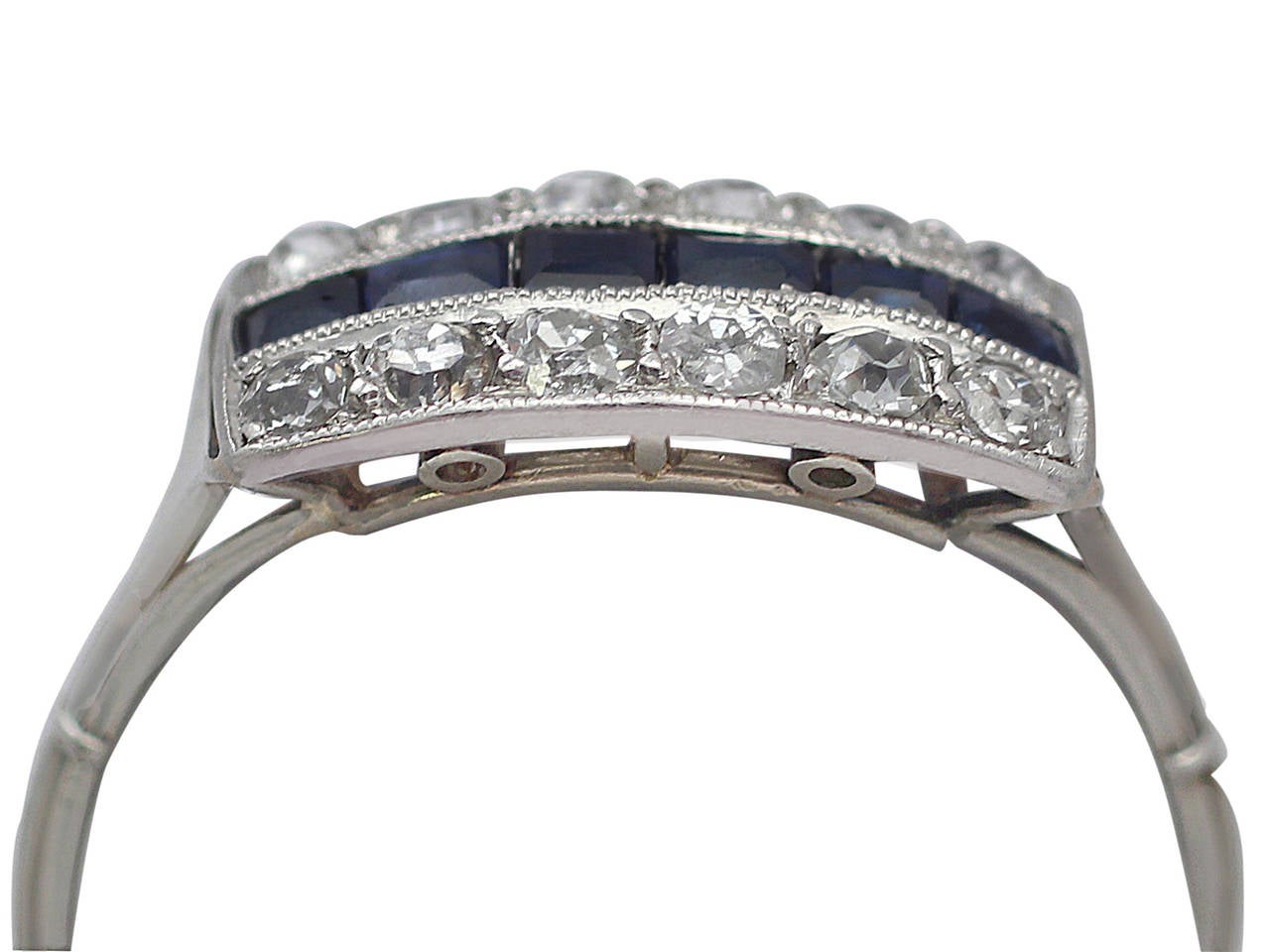 A fine and impressive antique French 0.24 carat natural sapphire and 0.30 carat diamond, 18 karat white gold dress ring; part of our antique jewelry and estate jewelry collections

This fine sapphire and diamond dress ring has been crafted in 18k
