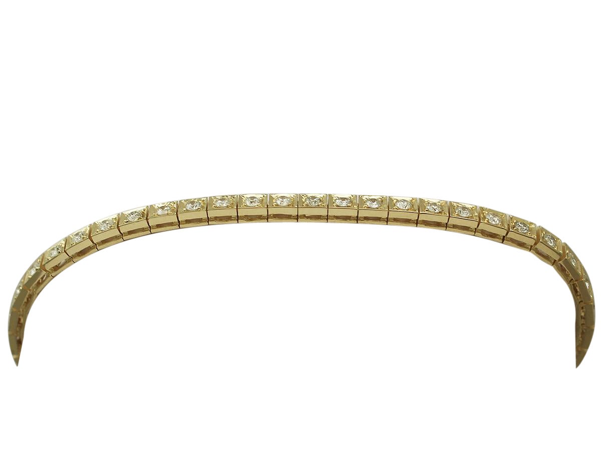 A fine and impressive 2.35 carat diamond and 18 karat yellow gold line bracelet; part of our diverse vintage jewelry and estate jewelry collections

This impressive vintage diamond line bracelet has been crafted in 18k yellow gold.

The