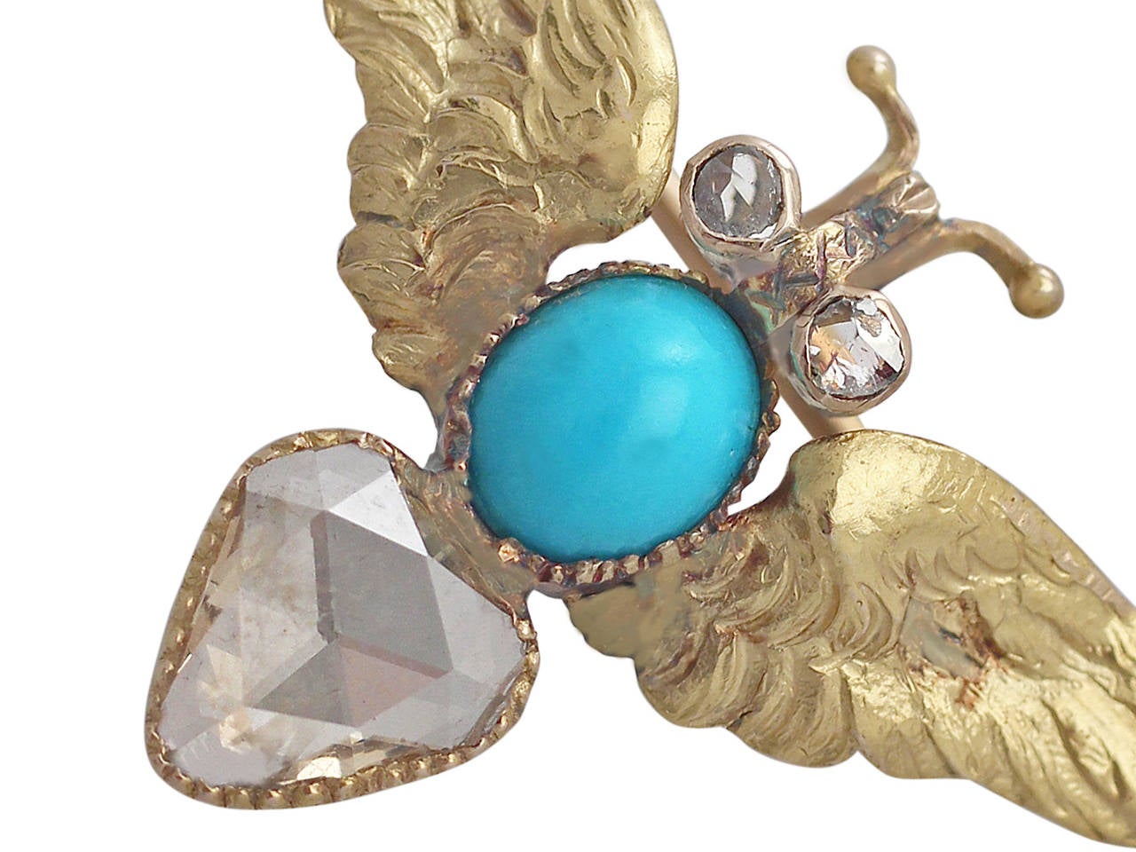 A fine antique 0.50 carat diamond and turquoise brooch modelled in 15 karat yellow gold in the form of an Egyptian scarab beetle; part of our diverse antique jewelry and estate jewelry collections

This fine antique turquoise brooch has been