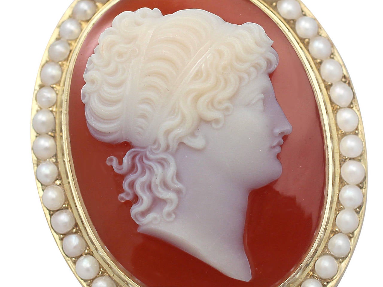 A fine and impressive antique Victorian cameo brooch with pearls, in 15 karat yellow gold; part of our antique jewelry and estate jewelry collections

This fine antique Victorian cameo brooch has been crafted in 15k yellow gold.

The cameo is bezel