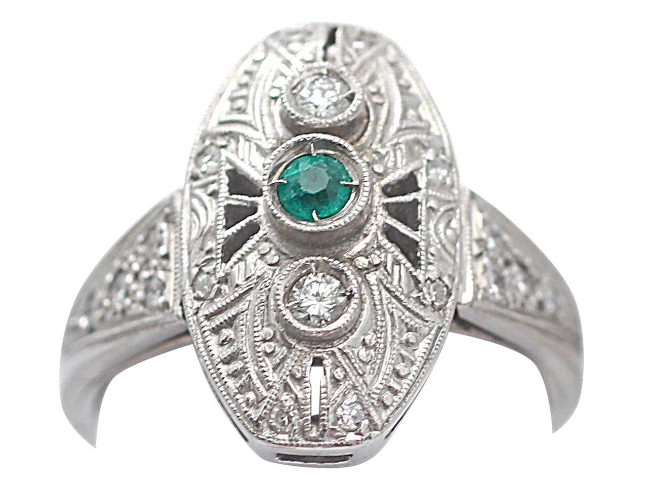 A fine vintage French emerald, 0.20 carat diamond and platinum ring in the Art Deco style; part of our vintage jewelry and estate jewelry collections

This fine vintage emerald and diamond ring has been crafted in platinum.

The ring has an