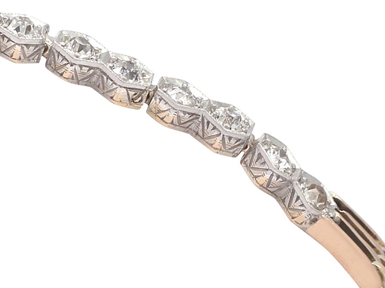 A fine and impressive 0.62 carat diamond, 15 karat yellow gold, 15 karat white gold set bracelet; part of our diverse antique jewelry and estate jewelry collections

This impressive original antique diamond bracelet has been crafted in 15k yellow