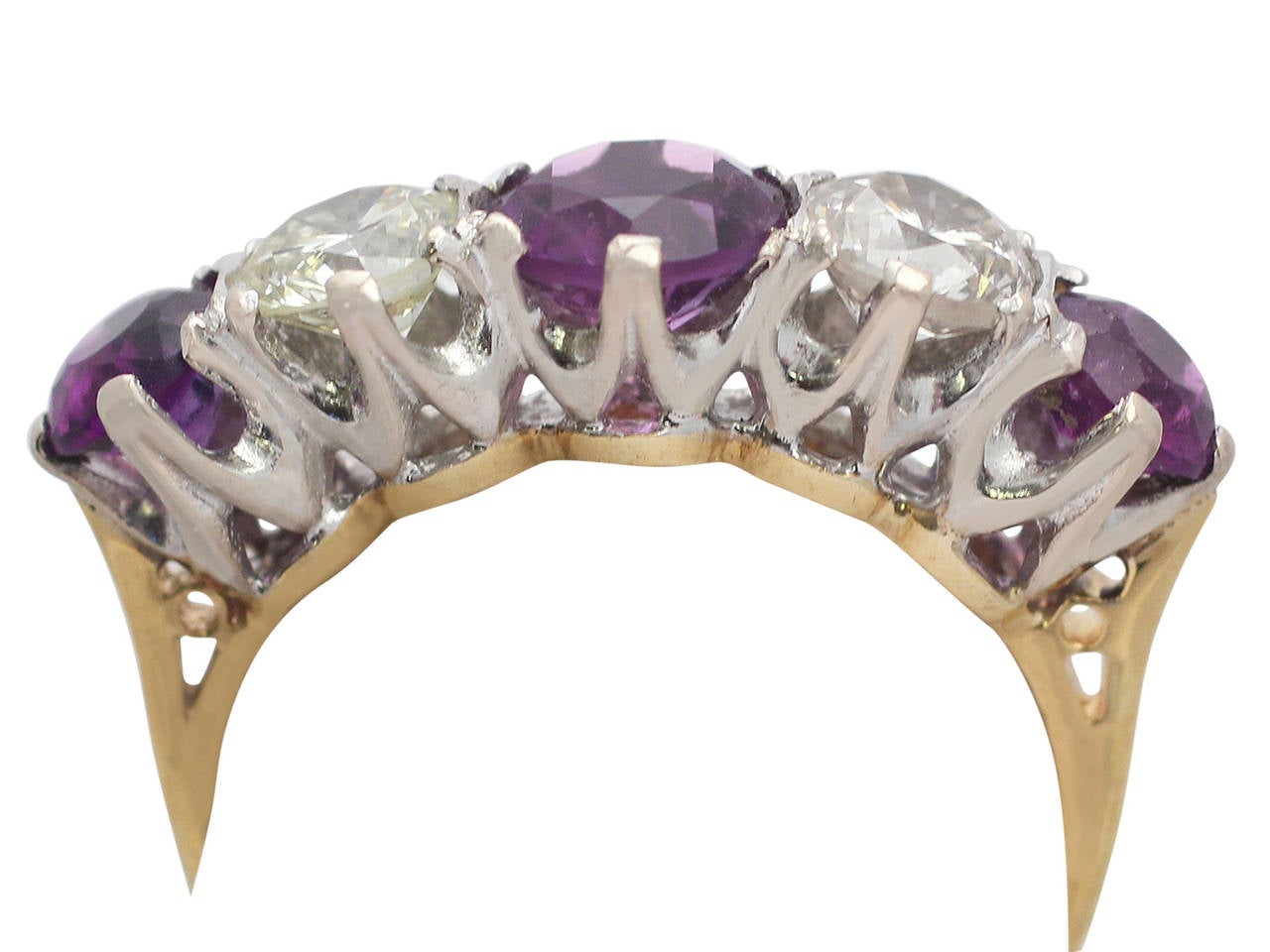 A fine antique 1.30 carat amethyst and 0.84 carat diamond, 18 karat yellow gold, platinum set cocktail ring; part of our antique jewelry and estate jewelry collections

This fine antique amethyst cocktail ring has been crafted in 18k yellow gold