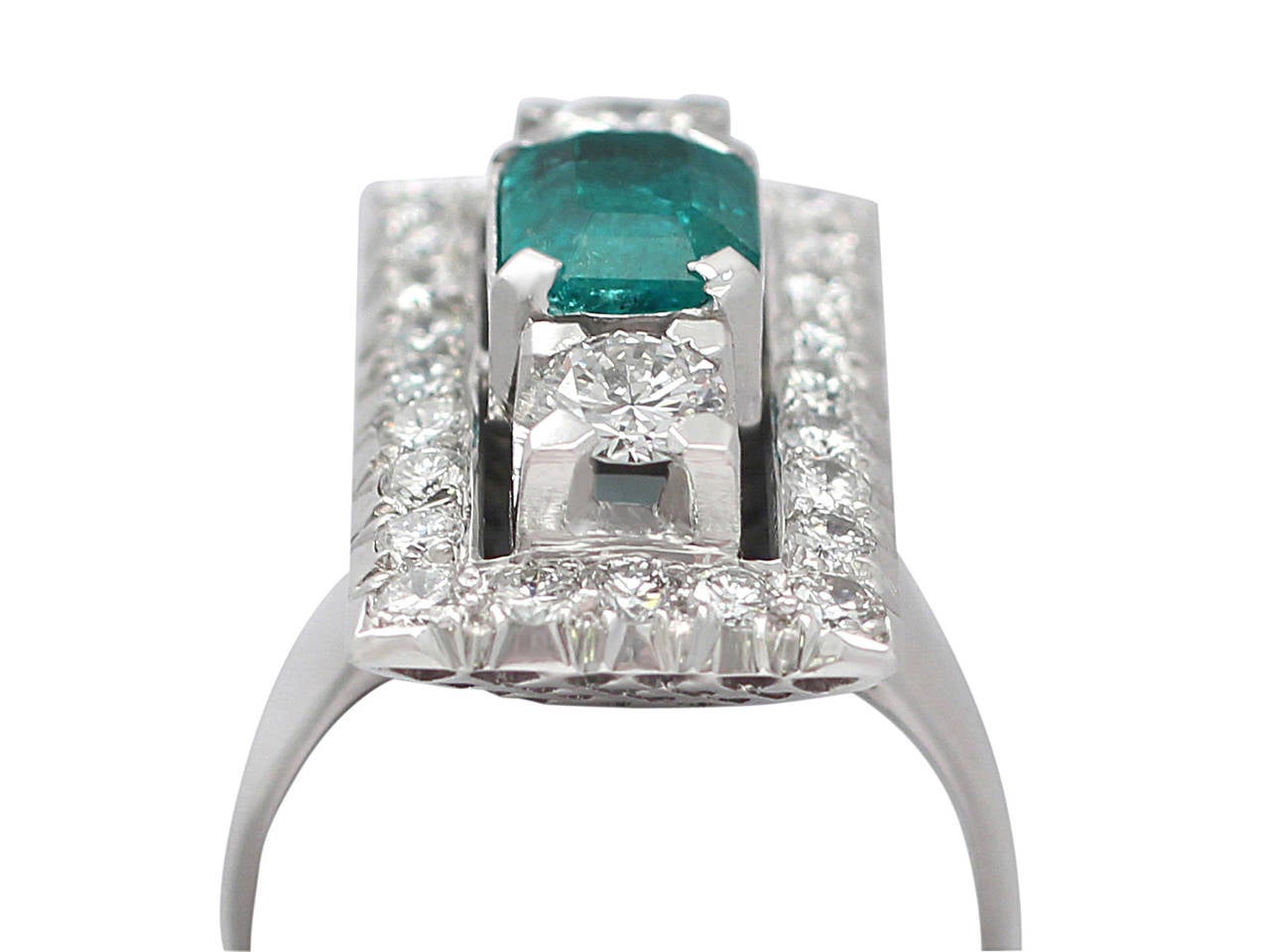 A stunning, fine and impressive 1.07 carat natural emerald and 1.78 carat diamond, 18 karat white gold, platinum set Art Deco ring; part of our diverse range of emerald jewellery

This stunning vintage French Art Deco dress ring has been crafted