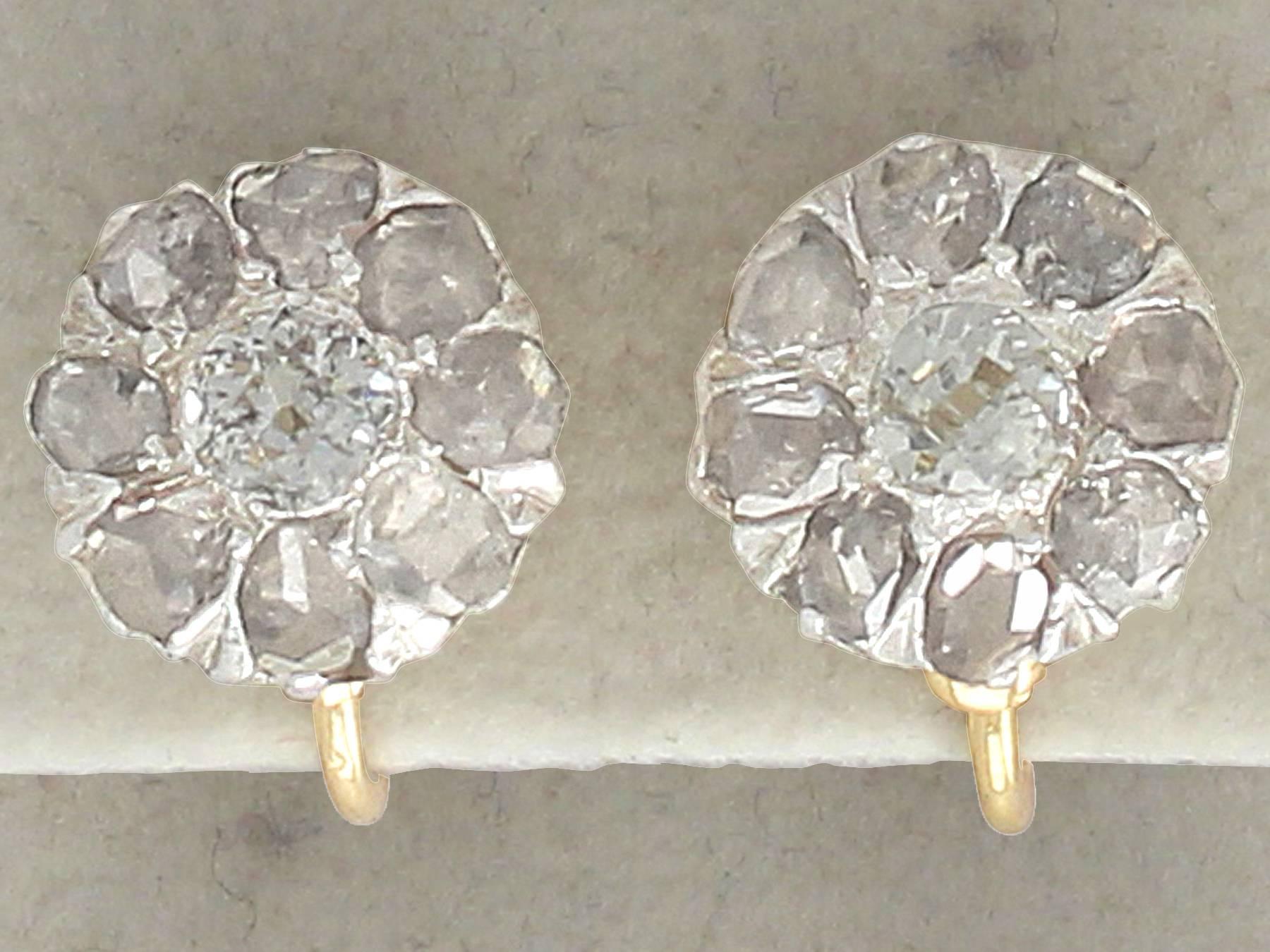 A fine and impressive pair of antique 2.32 carat diamond, 18 karat yellow gold, silver set earrings; part of our antique jewelry and estate jewelry collections

These fine and impressive diamond cluster earrings have been crafted in 18k yellow gold