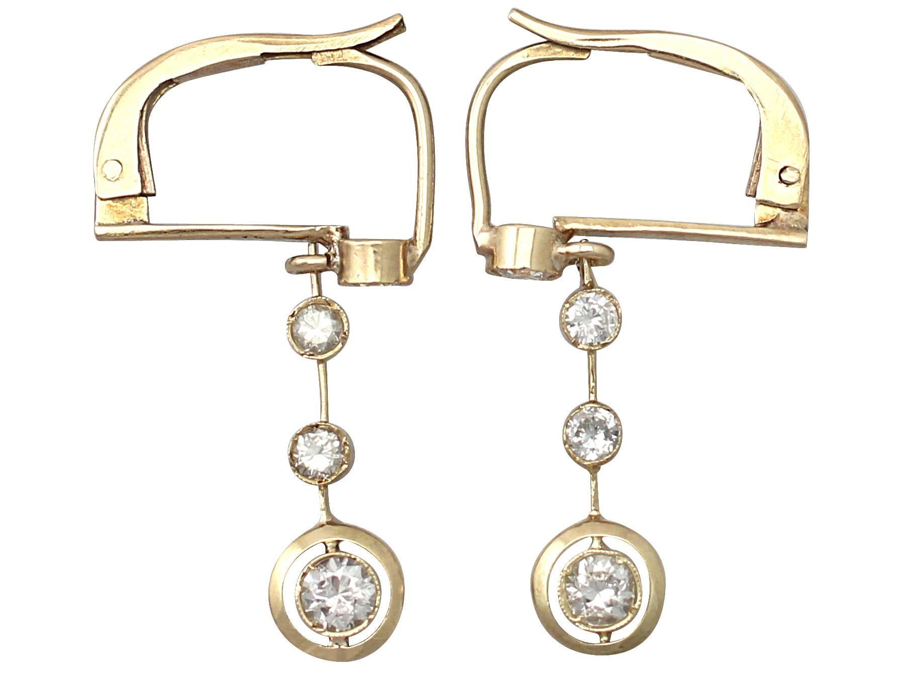 A fine and impressive pair of antique 0.74 carat diamond and 18 karat yellow gold drop earrings; part of our antique jewelry and estate jewelry collections

These fine and impressive antique diamond drop earrings have been crafted in 18k yellow