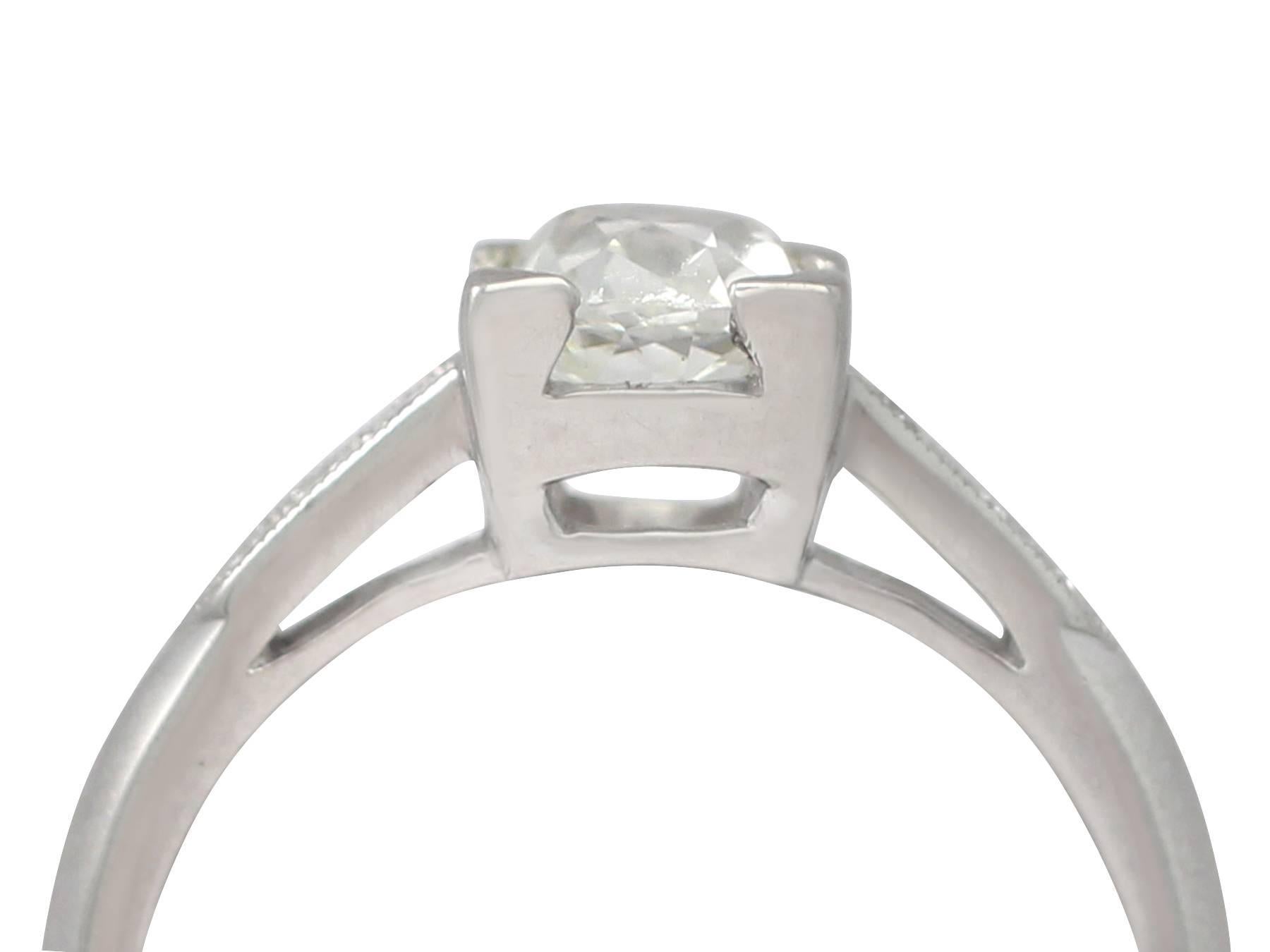 A stunning, fine and impressive antique 1.02 carat diamond solitaire, displayed in a contemporary platinum setting with 0.18 carat (total) diamonds; part of our diverse diamond jewelry and estate jewelry collections

This stunning, fine and