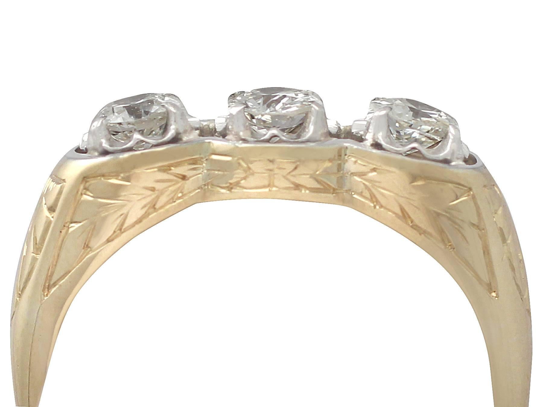 A fine and impressive vintage 0.60 carat diamond and 15 karat yellow gold, platinum set three stone/trilogy ring; part of our diverse diamond jewelry and estate jewelry collections

This fine and impressive diamond trilogy ring has been crafted in