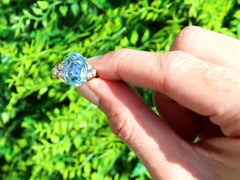 1990s Oval Cut Aquamarine and Diamond Yellow Gold Cocktail Ring
