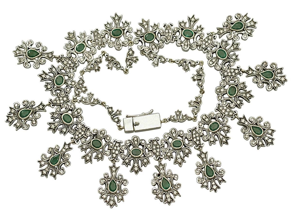 A stunning, fine and impressive vintage emerald drop necklace set with 5.25 carat emeralds and 5.47 carat diamonds in silver and 9 karat yellow gold; part of our diverse necklace collection

This impressive and unusual 1950s collarette has been